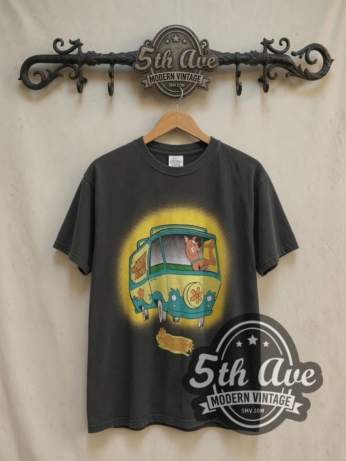 Scooby-Doo The Mystery Machine vintage cartoon tee, front view on a display rack