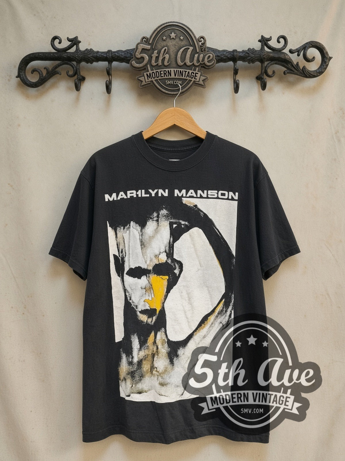 Marilyn Manson 'I Don't Like the Drugs' (But the Drugs Like Me) vintage band t-shirt in black, front view on a display rack