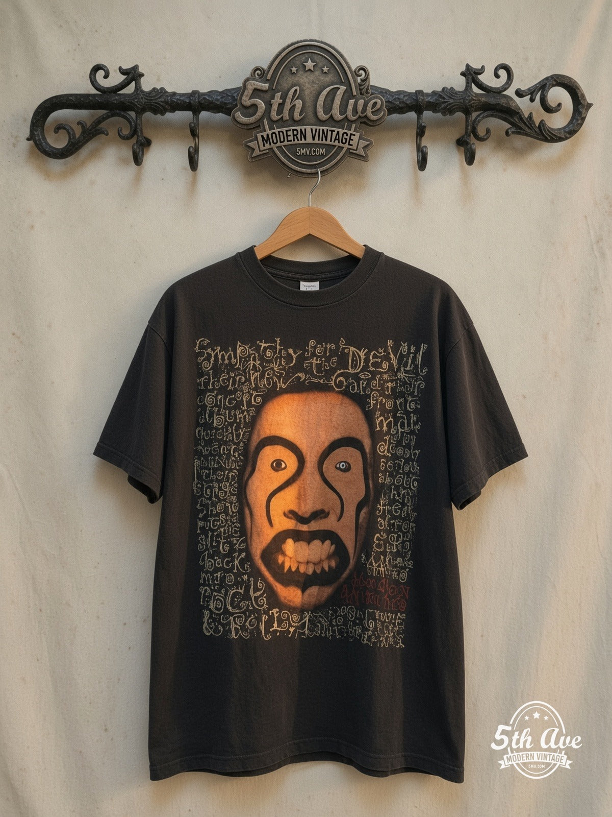Marilyn Manson – Four Portrait Grid MM Emblem – Vintage Band T-Shirt — front on locked cream ornate 5th Ave rack