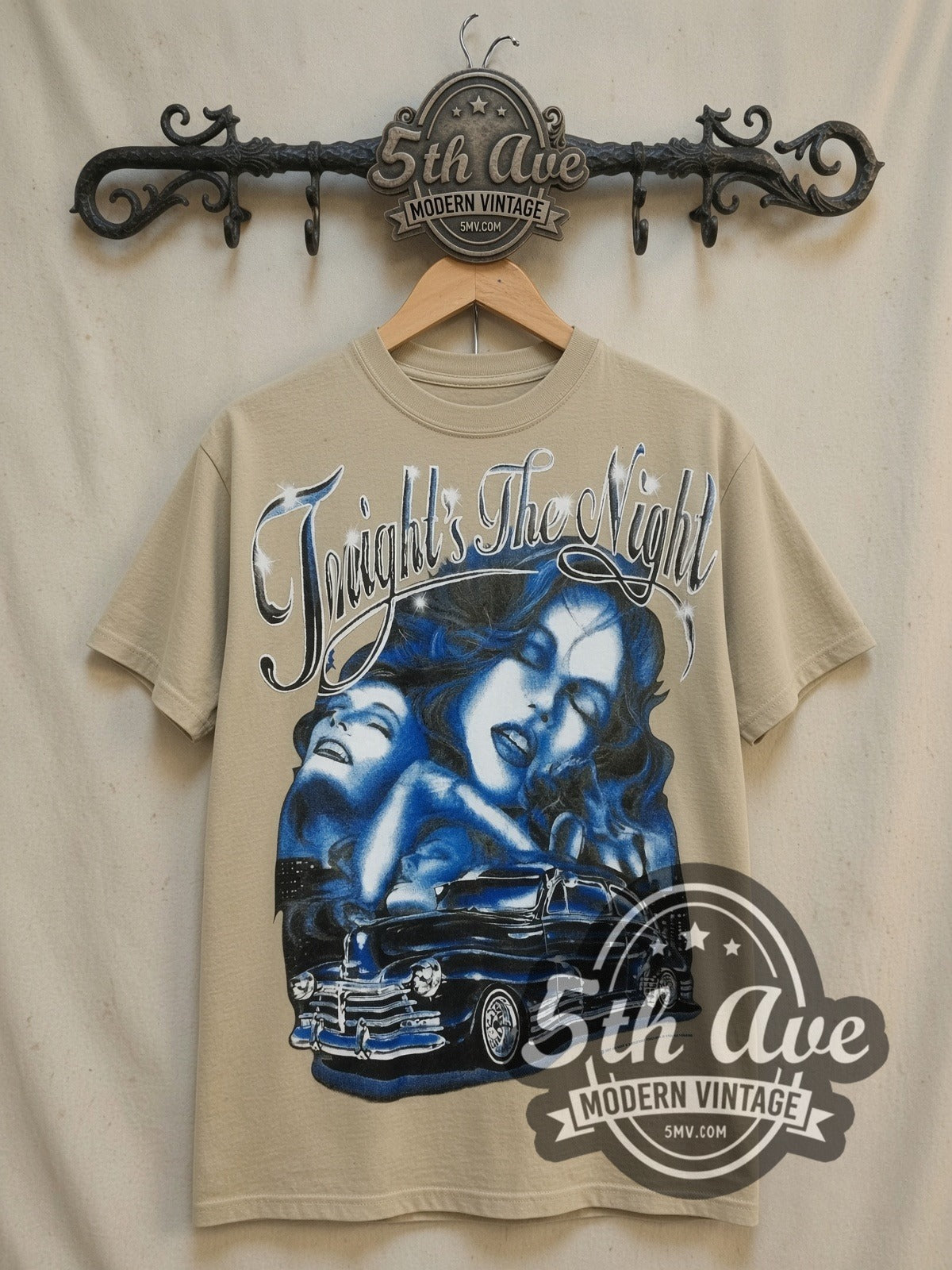 Rollin Hard Tonight's the Night Lowrider vintage graphic tee in sand, front view on a display rack