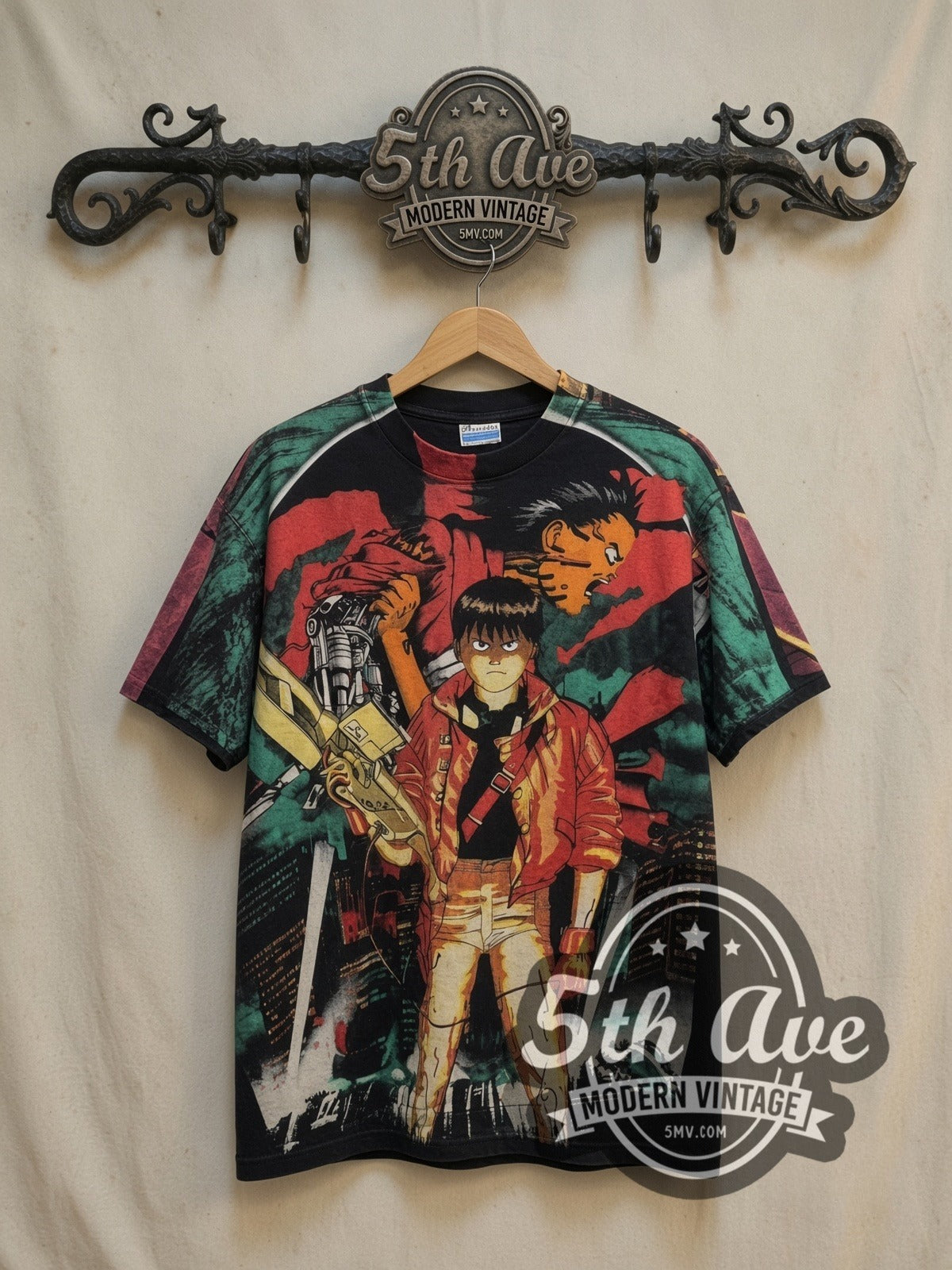 Akira all-over-print vintage anime tee, front view on a display rack