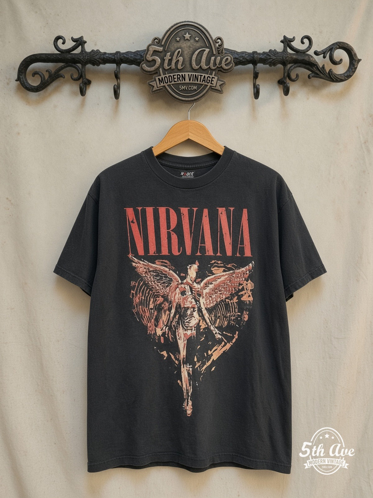Nirvana – In Utero Distressed Angel Yellow Back Print – Vintage Band T-Shirt — front on locked cream ornate 5th Ave rack