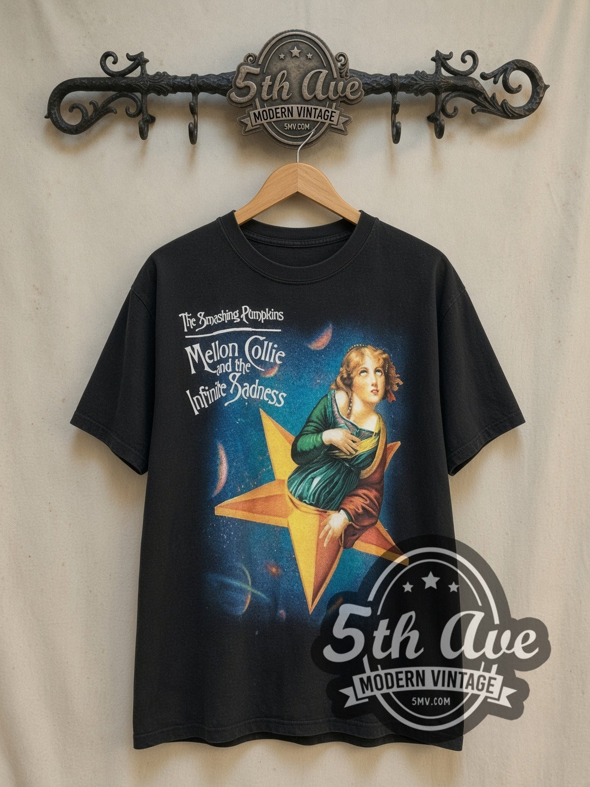 The Smashing Pumpkins Mellon Collie and the Infinite Sadness vintage band t-shirt, front view on a display rack