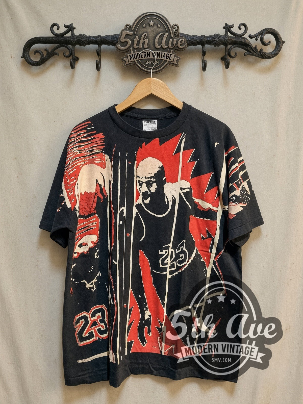 Michael Jordan Number 23 all-over-print vintage basketball tee, front view on a display rack