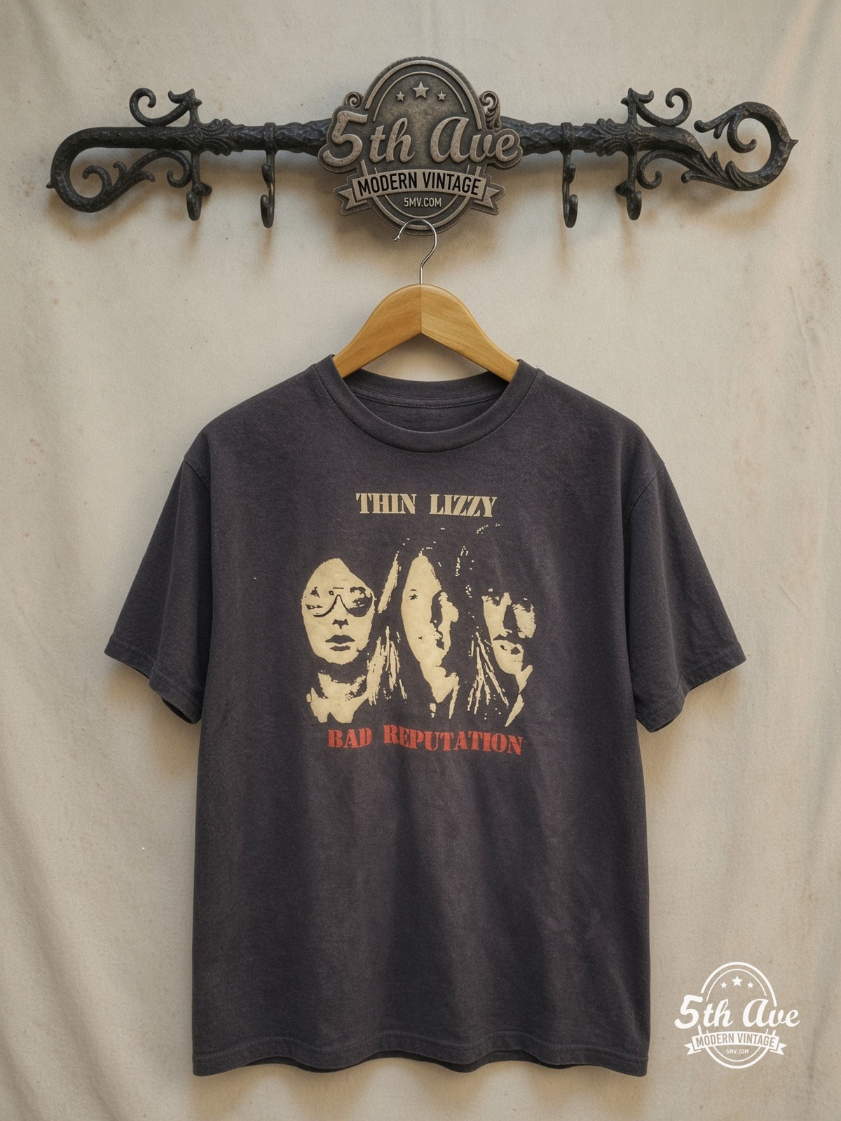 Thin Lizzy – Bad Reputation Album Cover – Vintage Band T-Shirt — front on locked cream ornate 5th Ave rack