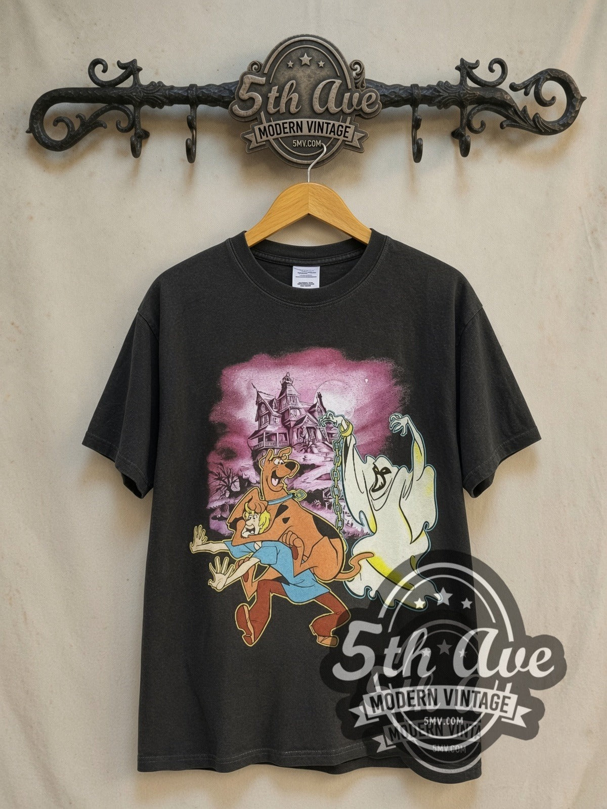Scooby-Doo Haunted Mansion vintage cartoon tee in black, front view on a display rack