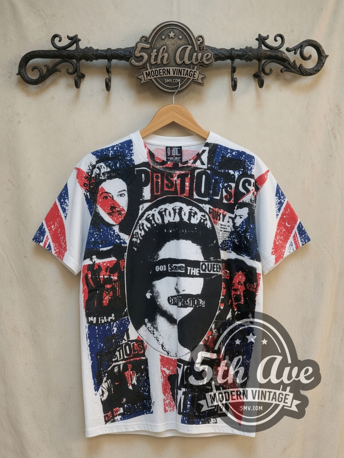 Sex Pistols God Save the Queen all-over-print vintage band t-shirt, front view on a display rack