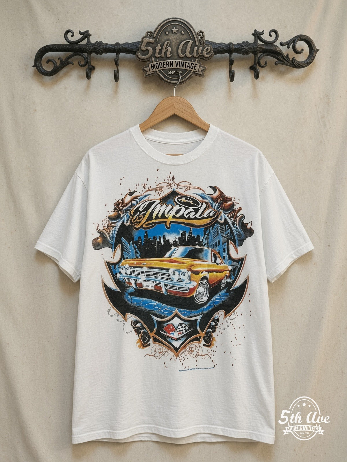 Rollin Hard – '65 Impala Lowrider – Vintage Graphic Tee — front on locked cream ornate 5th Ave rack