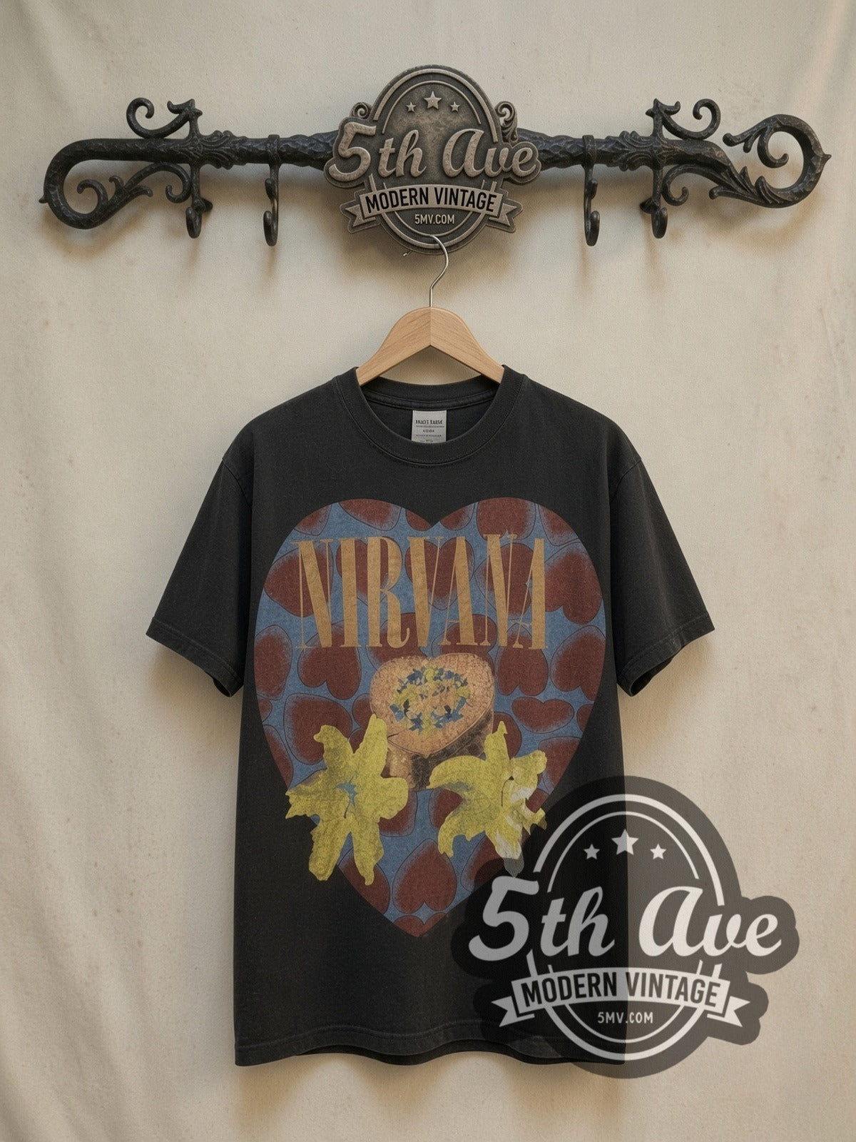 Nirvana Heart Shaped Box vintage band t-shirt, front view on a display rack