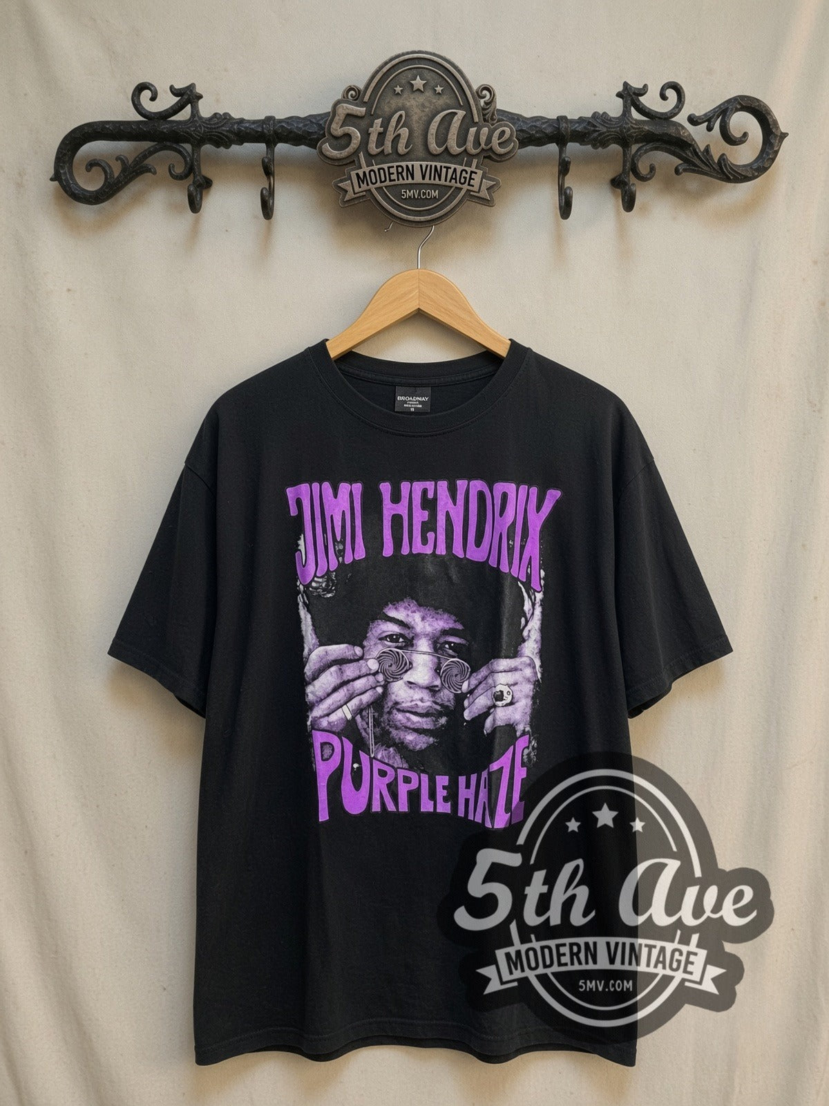 Jimi Hendrix Purple Haze vintage band t-shirt, front view on a display rack