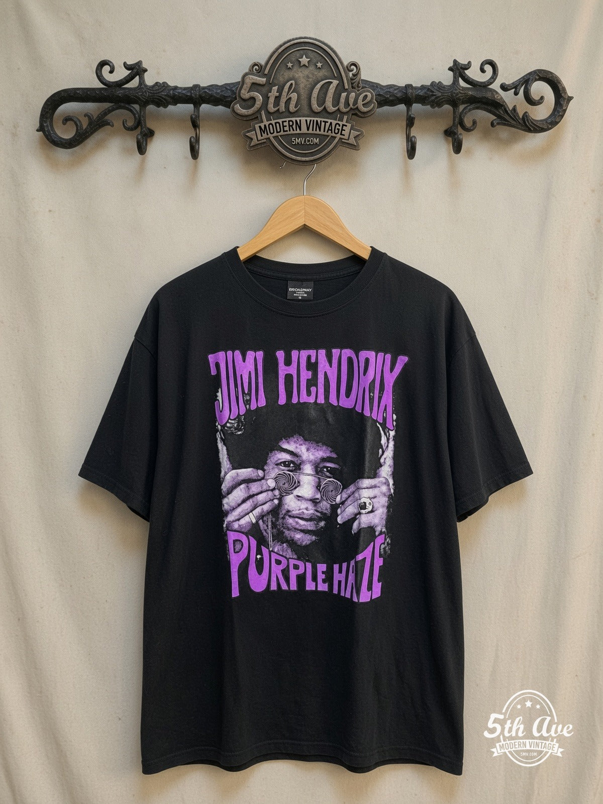 Purple Haze Experience: New Vintage Jimi Hendrix t shirt – Vintage Band T-Shirt — front on locked cream ornate 5th Ave rack