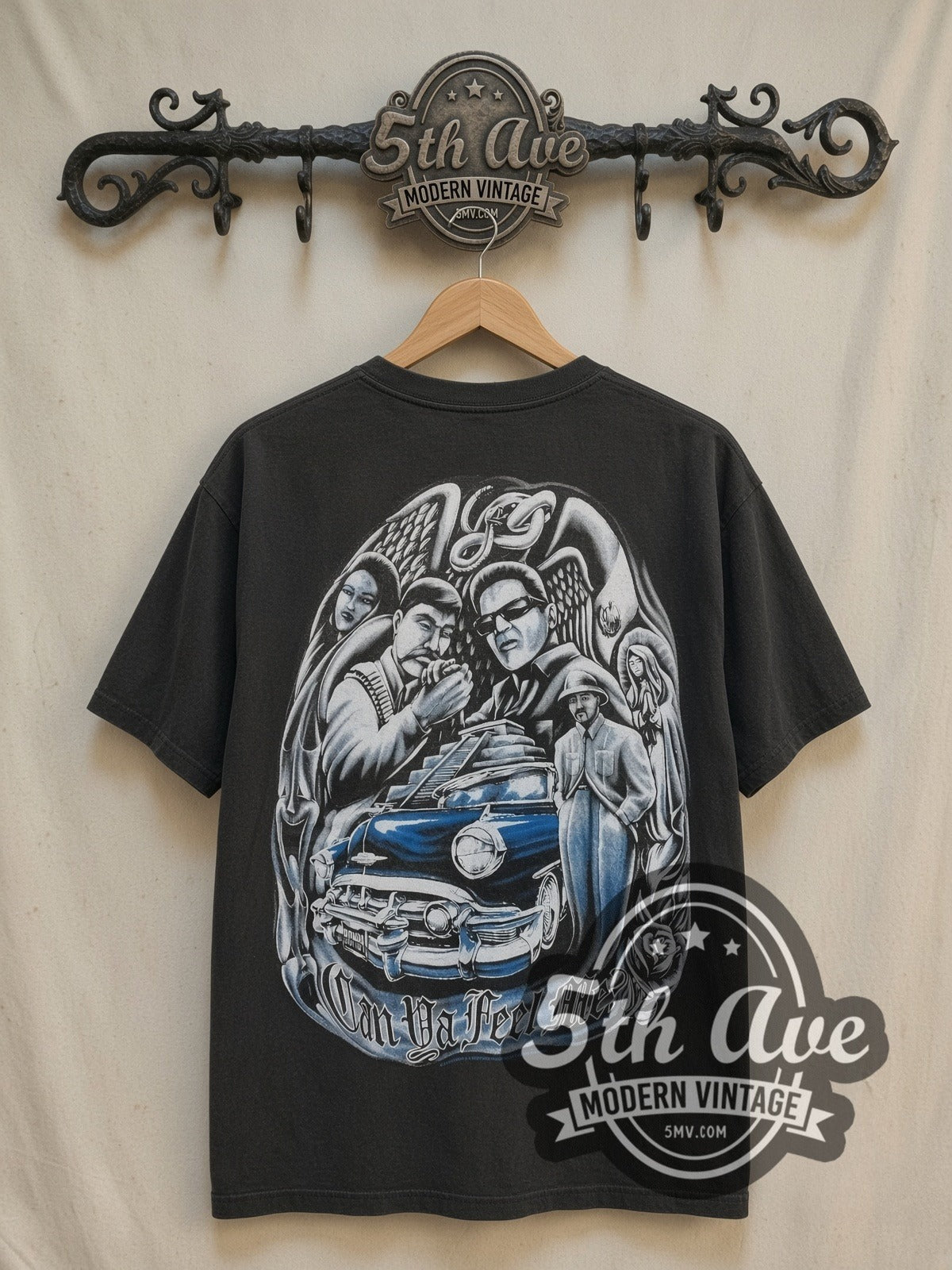 Rollin Hard Low Rider Culture Tribute vintage graphic tee, front view on a display rack