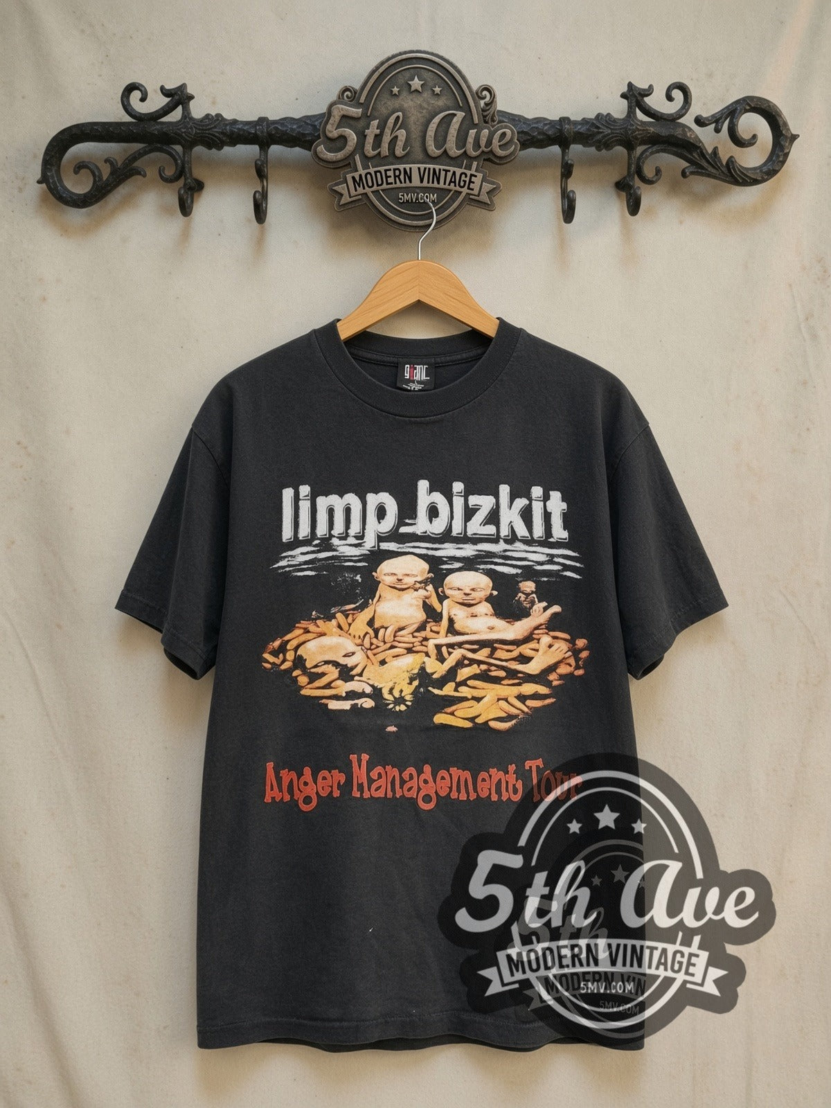 Limp Bizkit Anger Management Green Leaf Eminem Papa Roach vintage band t-shirt in black, front view on a display rack