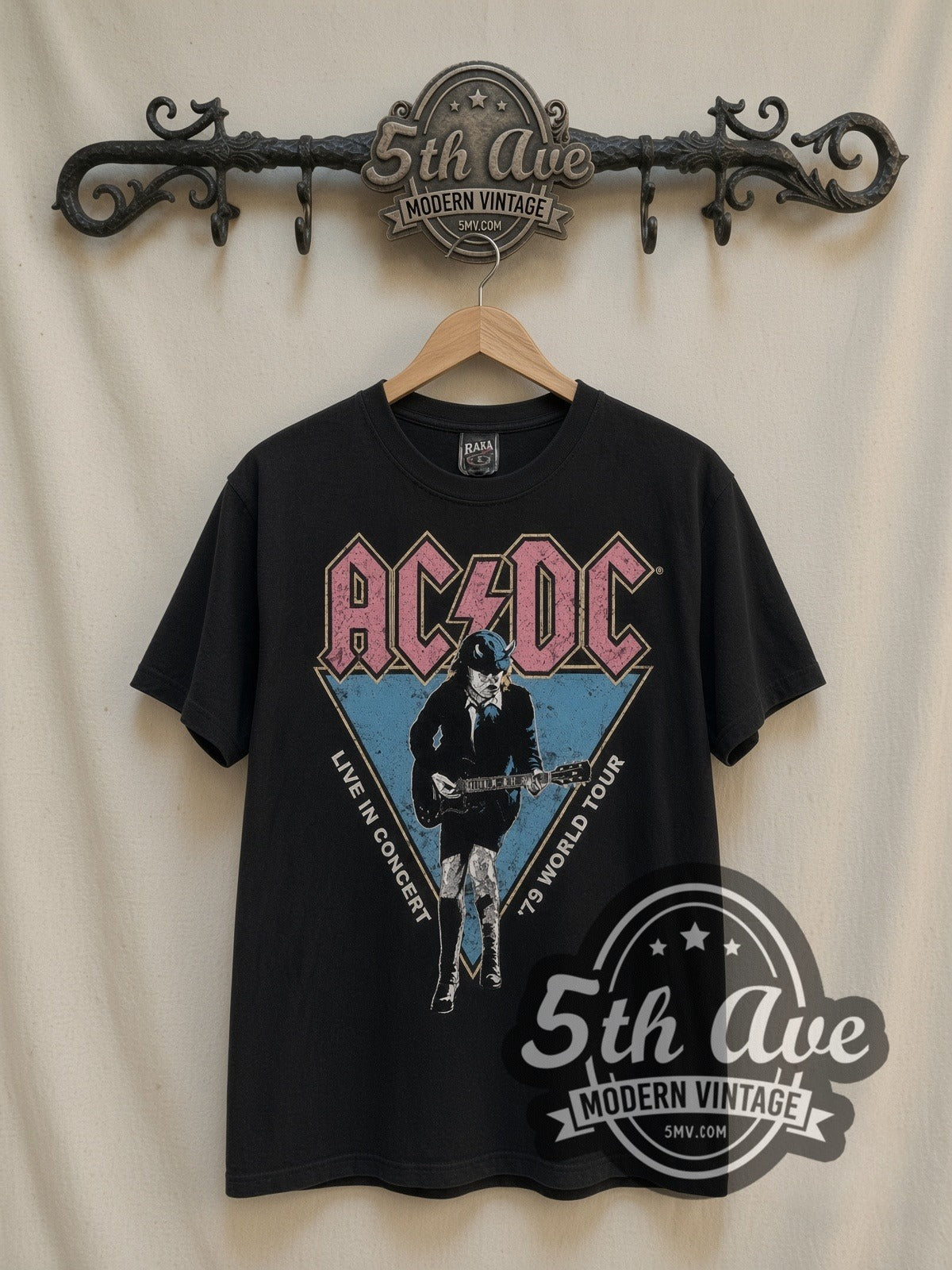 AC/DC Live in Concert '79 World Tour vintage band t-shirt in black, front view on a display rack