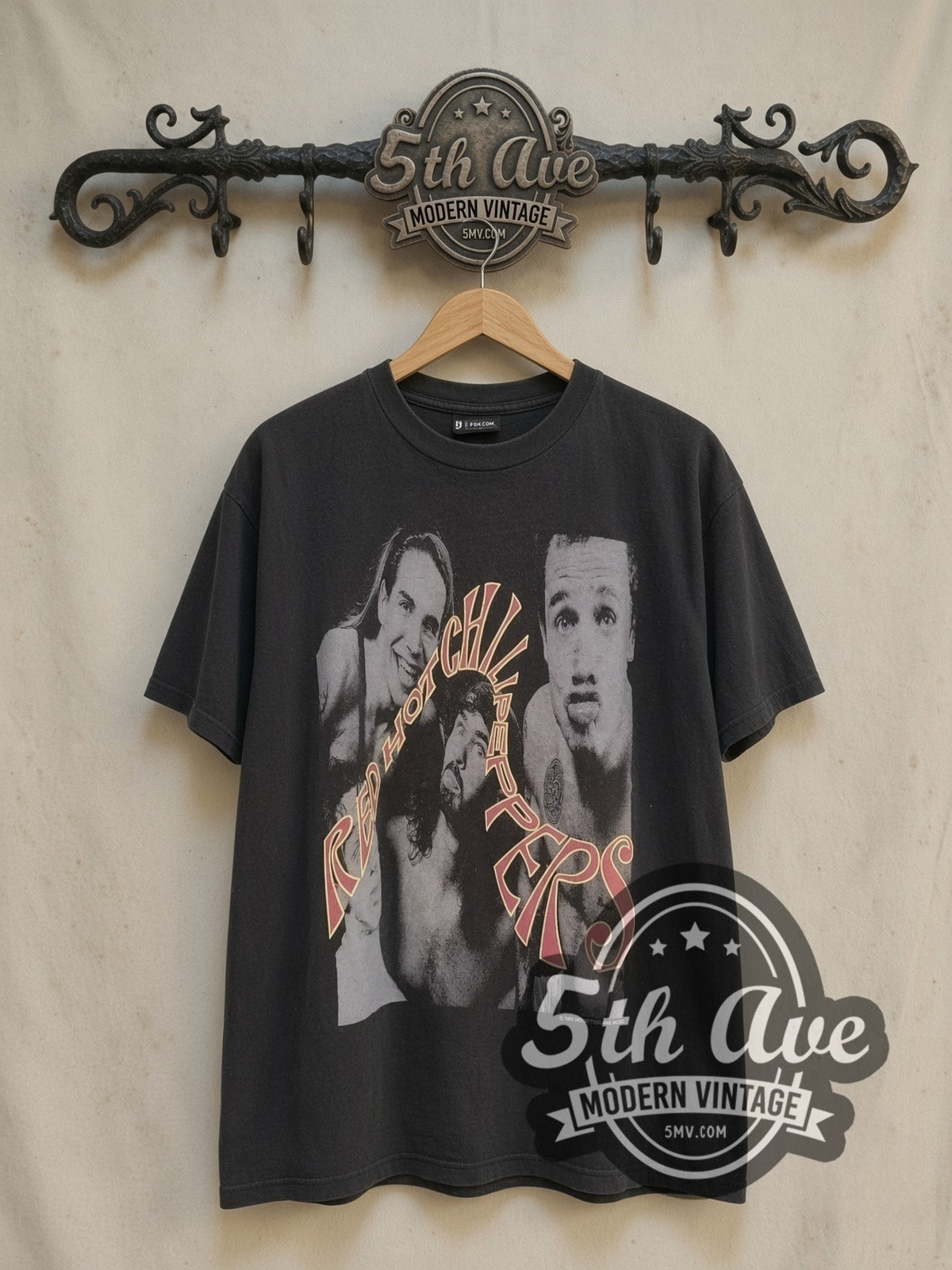 Red Hot Chili Peppers Psychedelic Swirl vintage band t-shirt, front view on a display rack