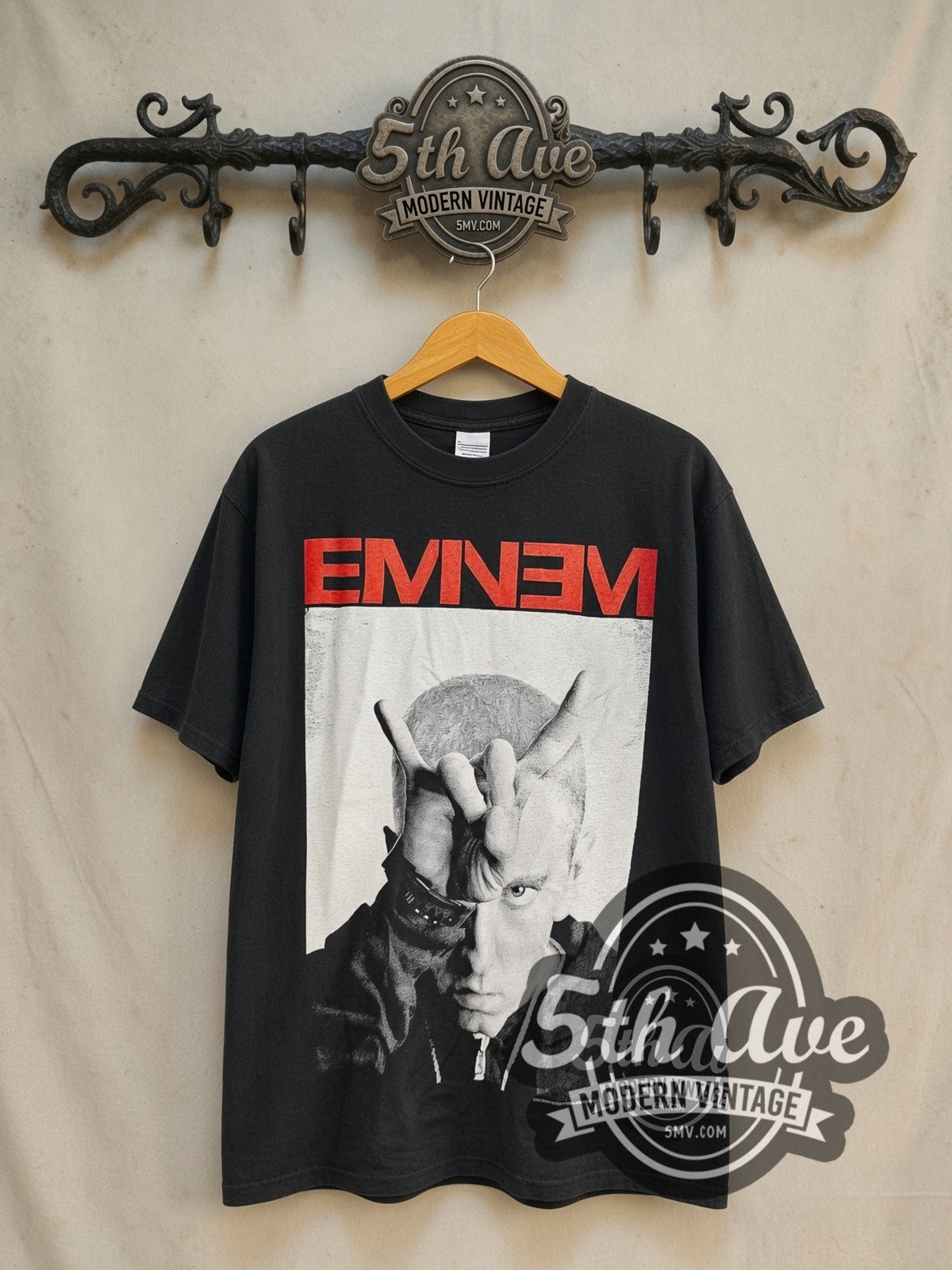 Eminem The Monster Tour 2014 "EMINƎM" vintage band t-shirt in black, front view on a display rack