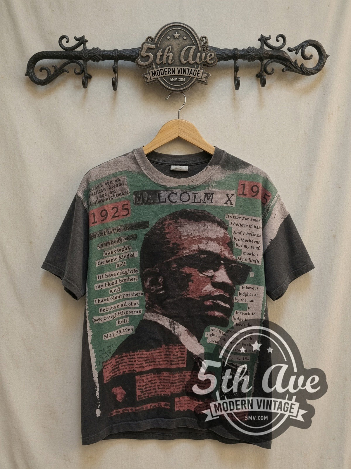 Malcolm X Mosquitohead all-over-print vintage movie t-shirt, front view on a display rack