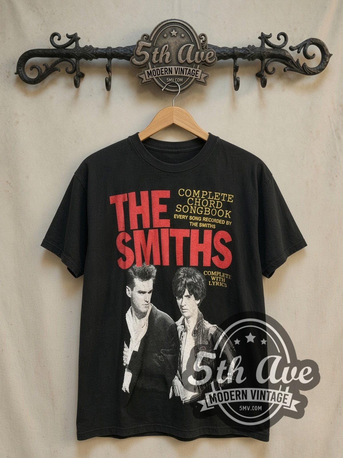 The Smiths Complete Chord Songbook vintage band t-shirt, front view on a display rack