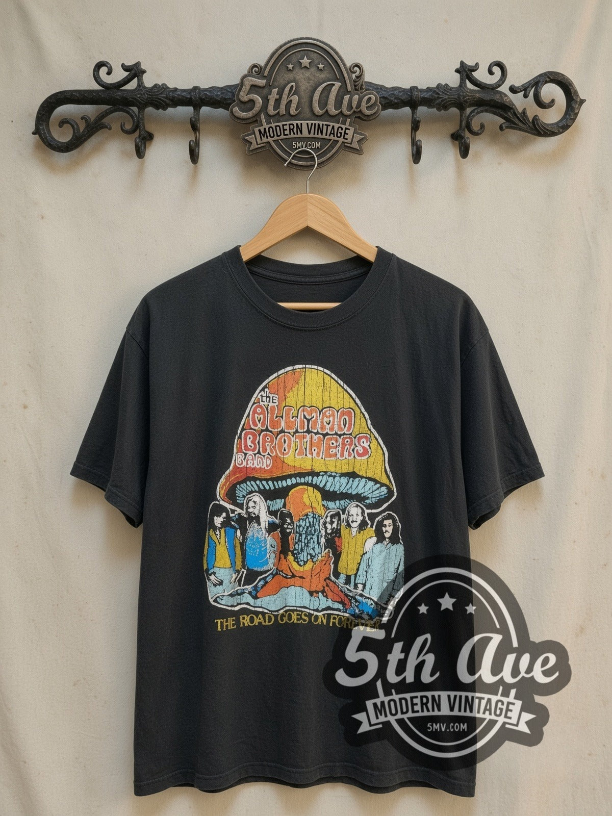The Allman Brothers Band The Road Goes On Forever vintage band t-shirt, front view on a display rack