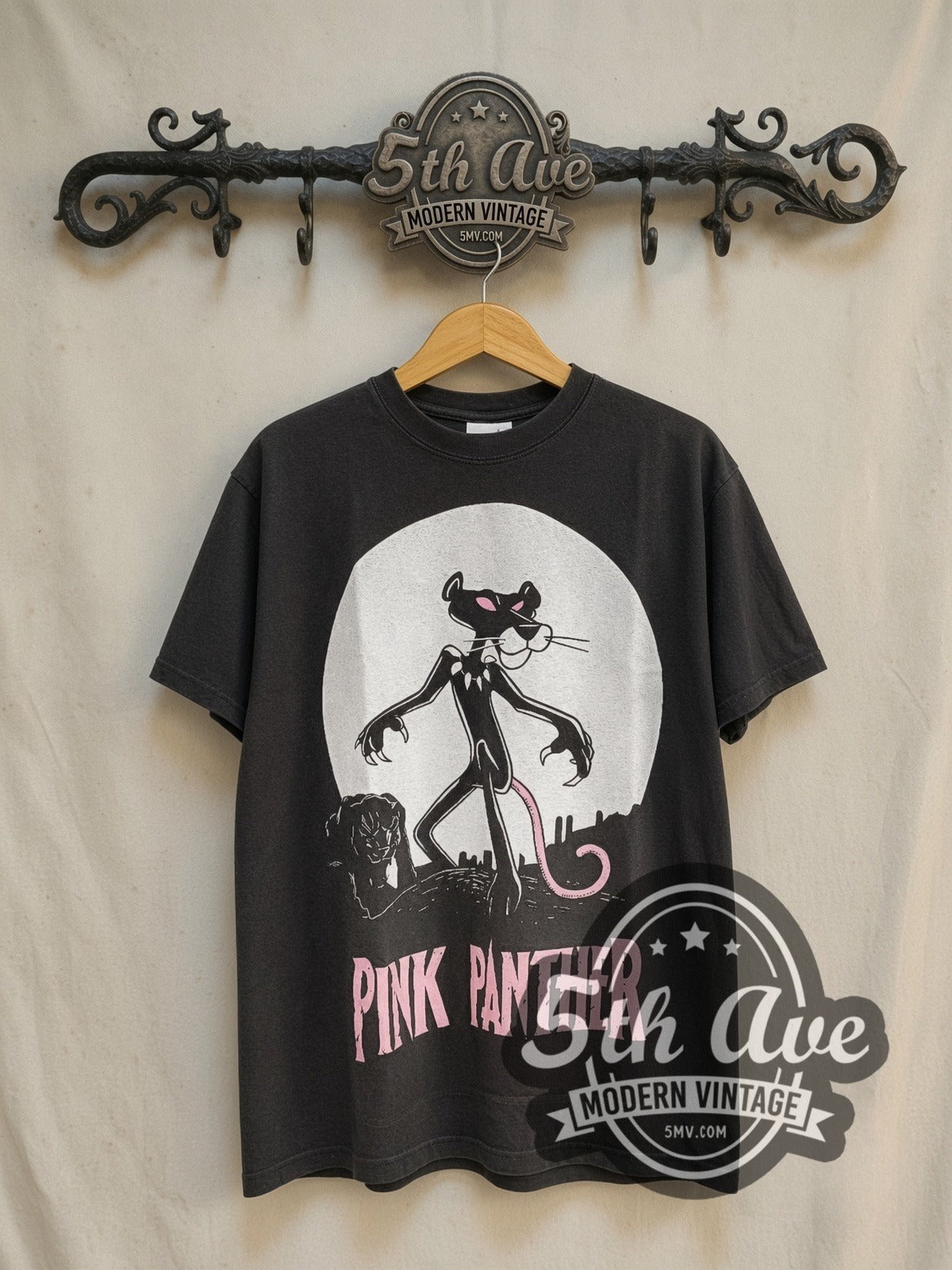 The Pink Panther Its Always Pink Inside vintage cartoon tee in black, front view on a display rack