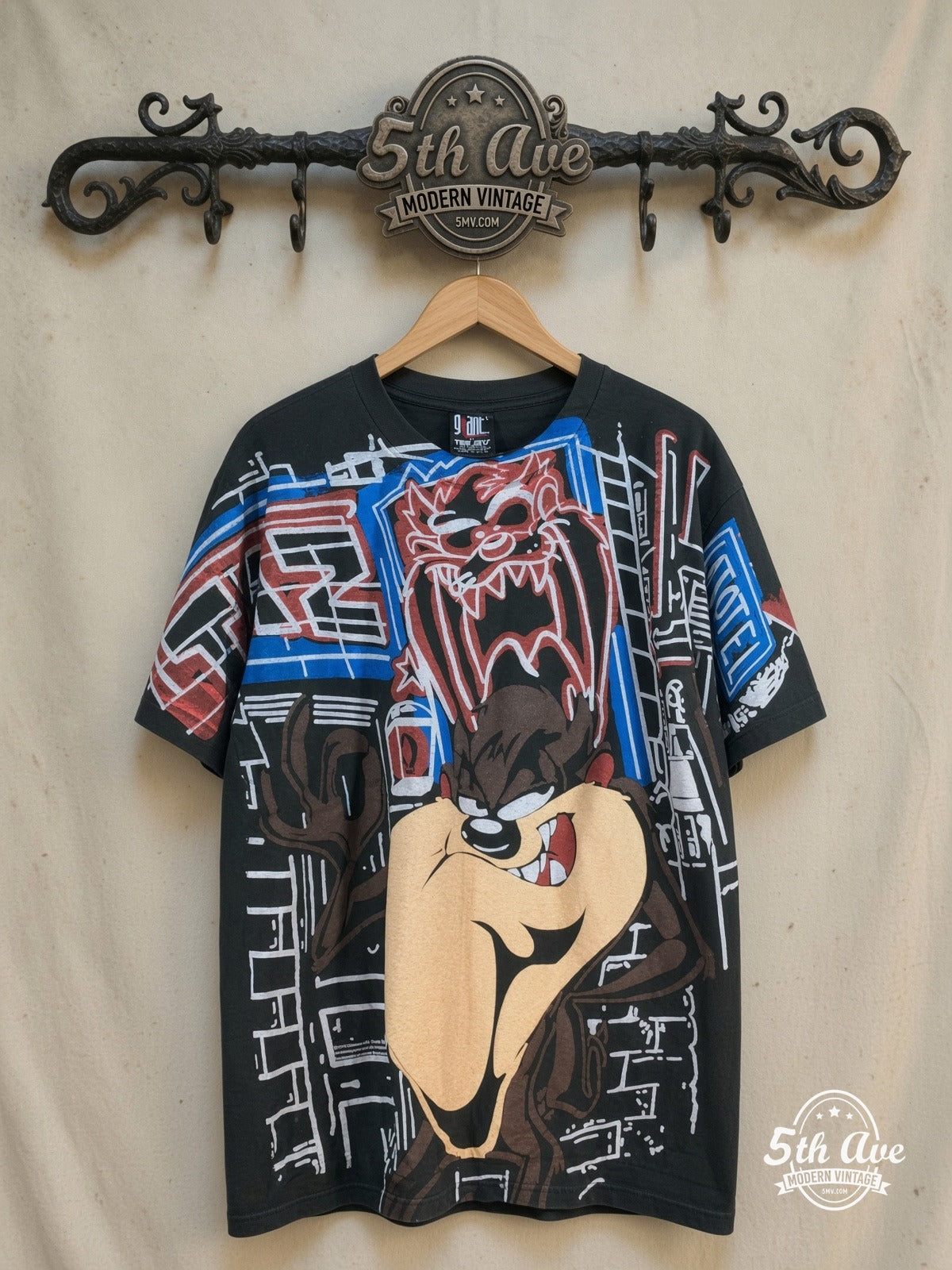 Looney Tunes – Taz-Mania Limited Edition – All Over Print – New Vintage Graphic Tee — front on locked cream ornate 5th Ave rack