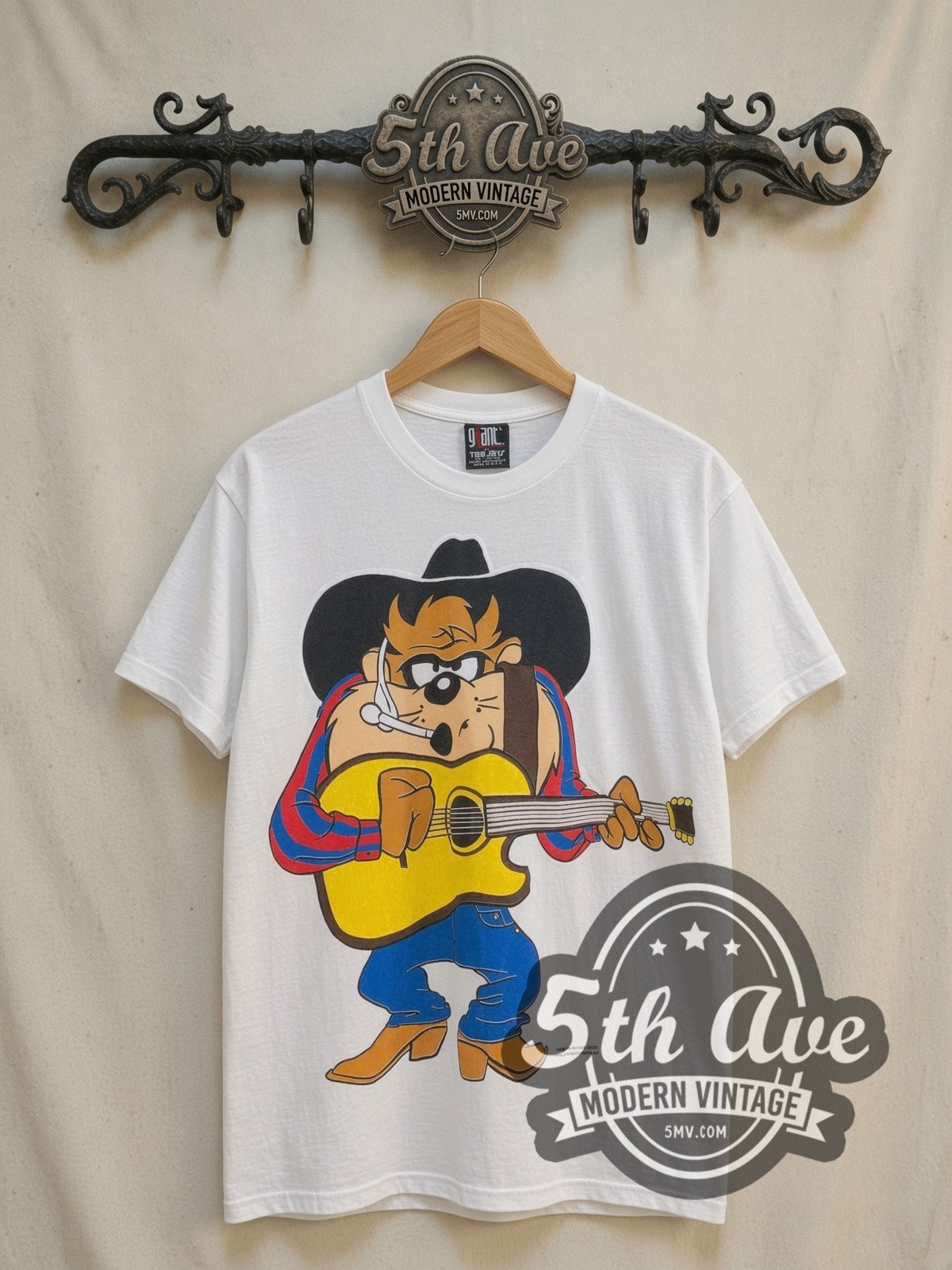 Looney Tunes Garth Brooks Taz-Mania vintage cartoon tee, front view on a display rack