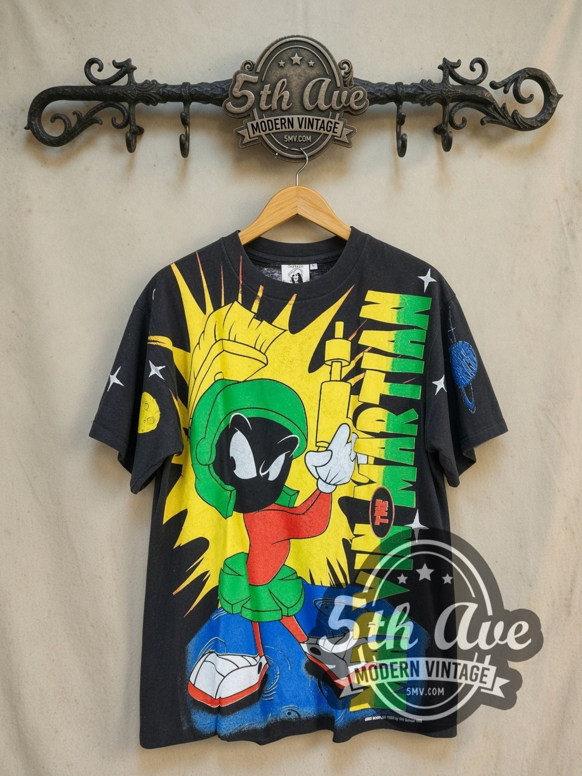 Looney Tunes Marvin the Martian all-over-print graphic tee, front view on a display rack