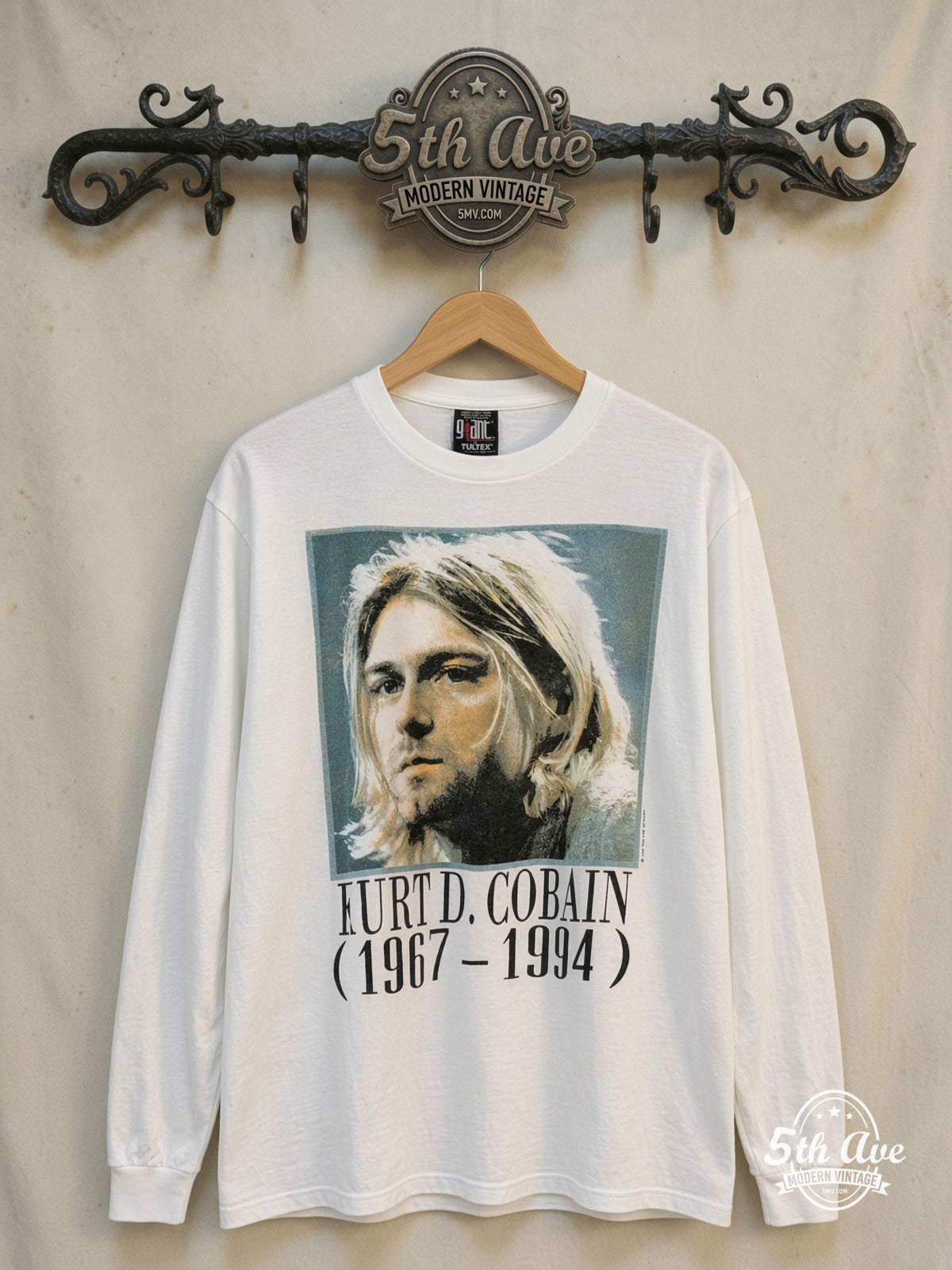 Kurt Cobain – Legacy Tribute – Vintage Band T-Shirt — front on locked cream ornate 5th Ave rack