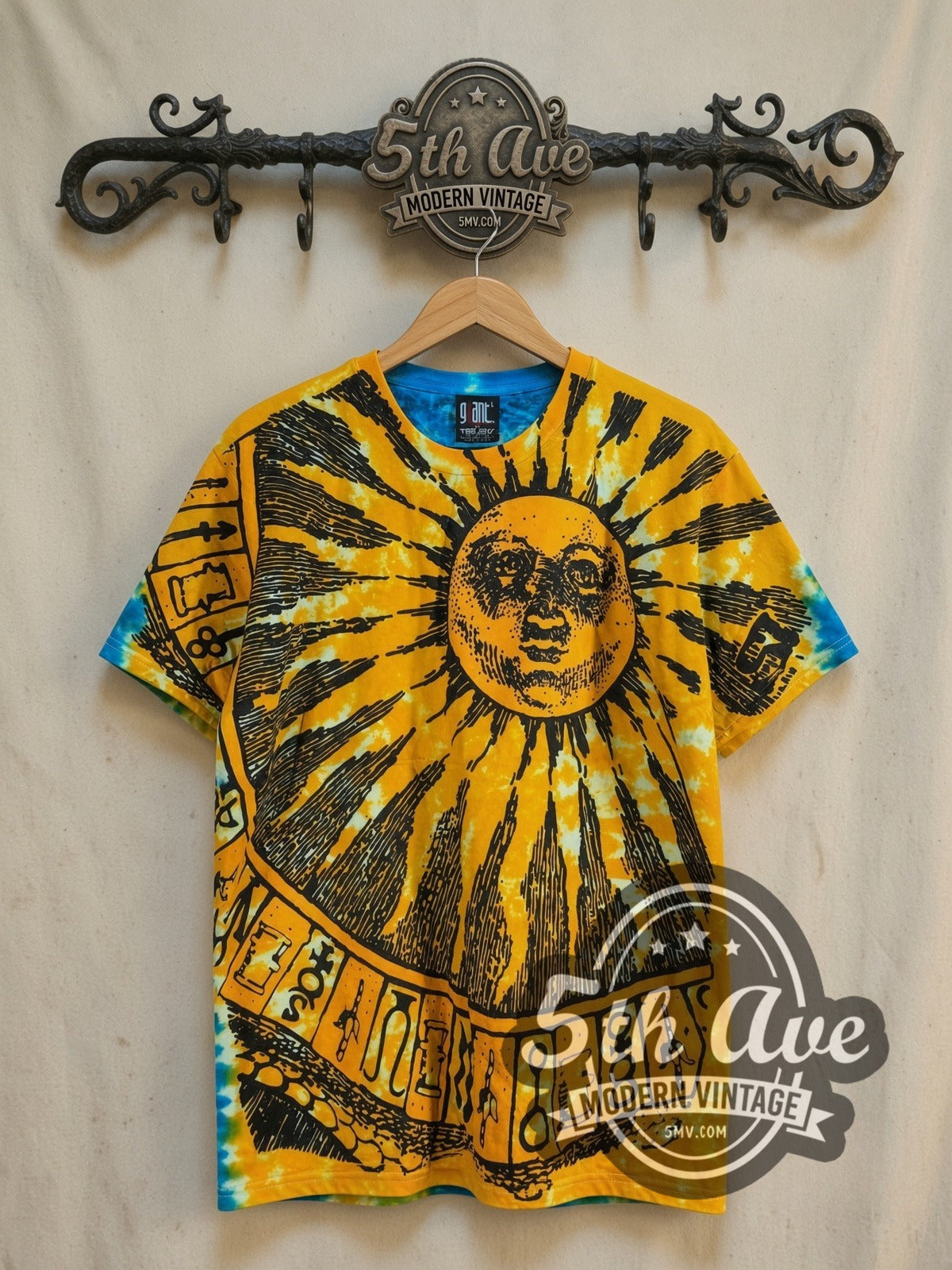 Sun and Moon Tie-Dye Sun and Moon all-over-print graphic tee, front view on a display rack