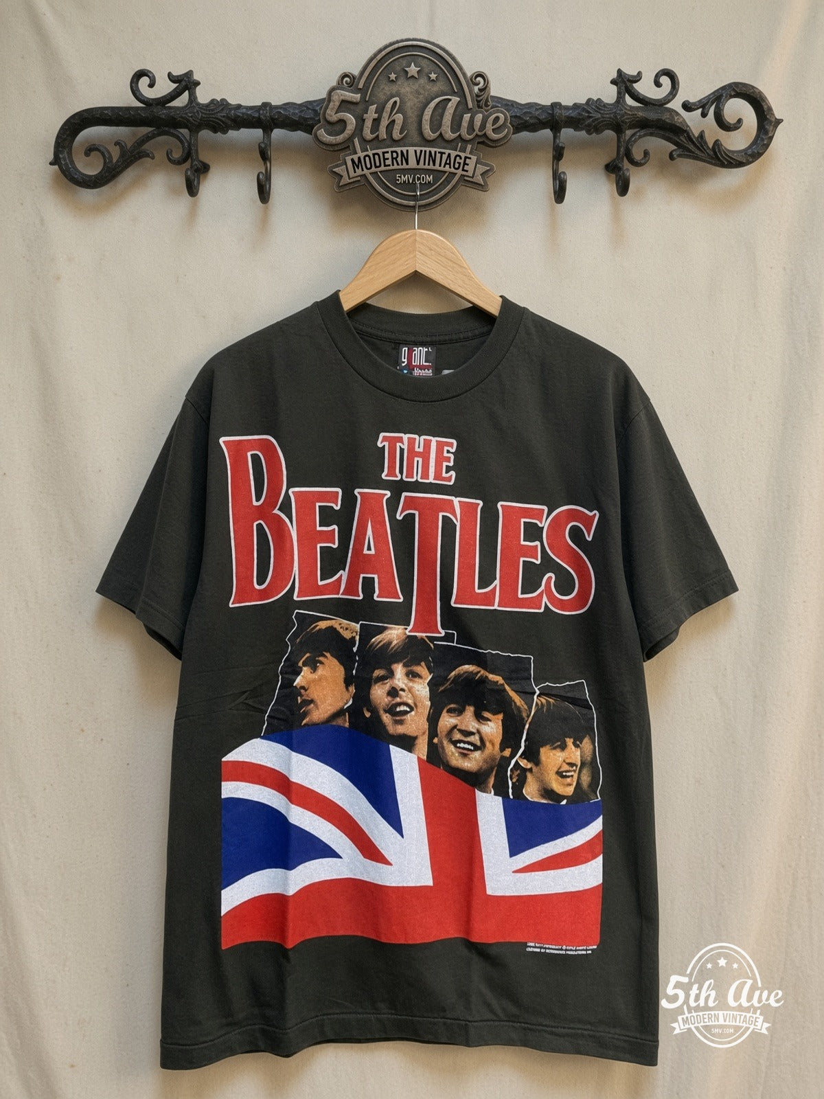 The Beatles – Union Jack Red Logo Mop-Top – Vintage Band T-Shirt — front on locked cream ornate 5th Ave rack