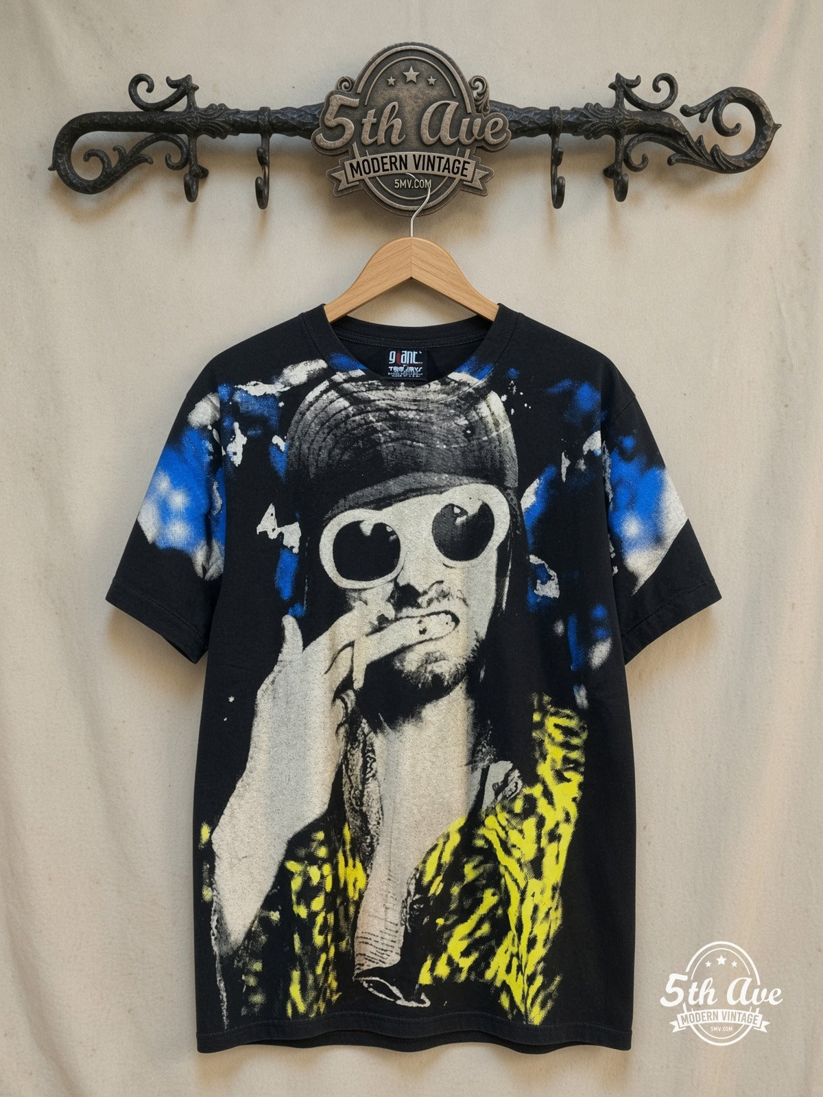 Nirvana – Kurt Cobain White Sunglasses Leopard Jacket All Over Print – Vintage Band T-Shirt — front on locked cream ornate 5th Ave rack
