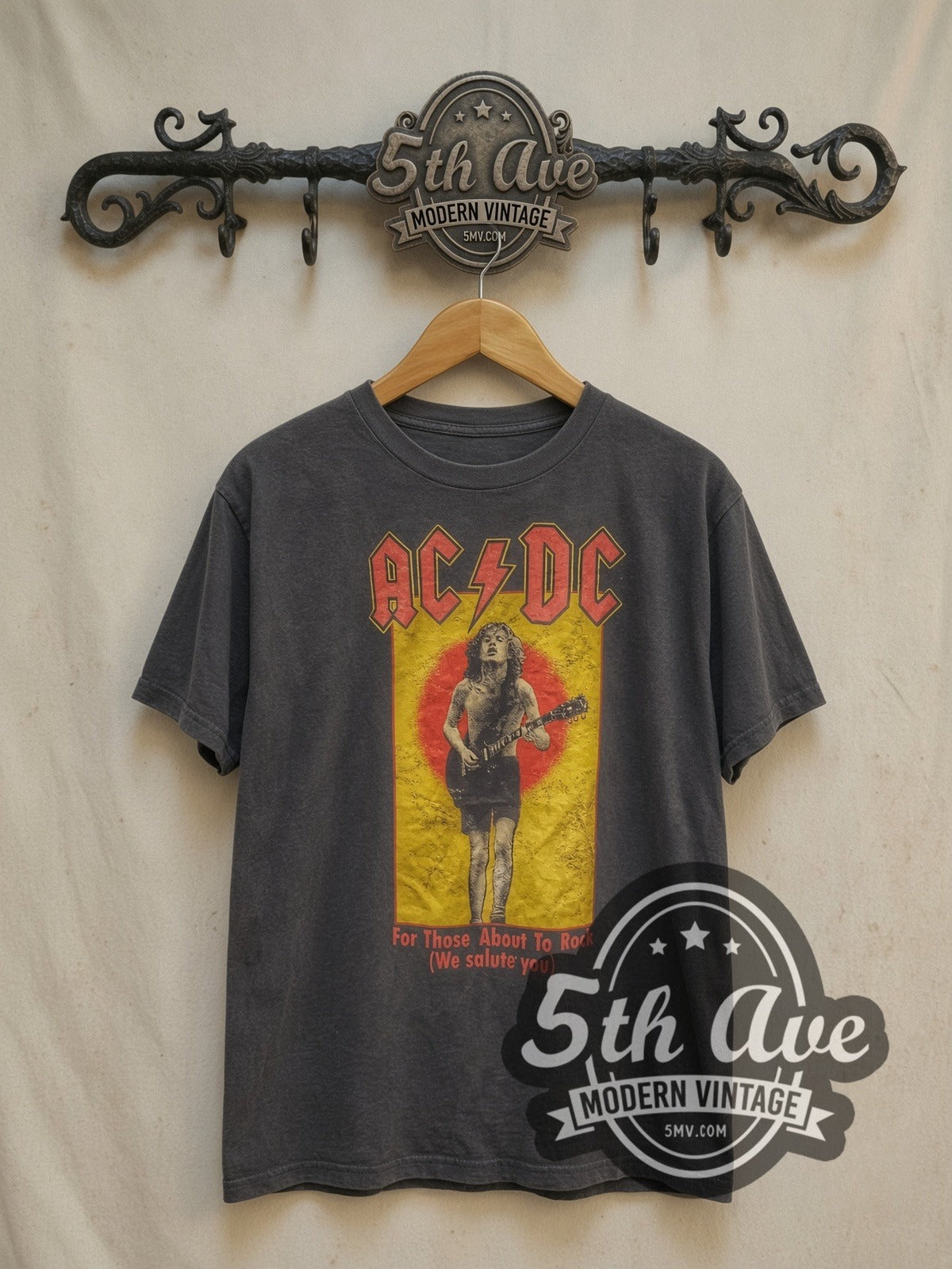 AC/DC For Those About to Rock Angus vintage band t-shirt, front view on a display rack