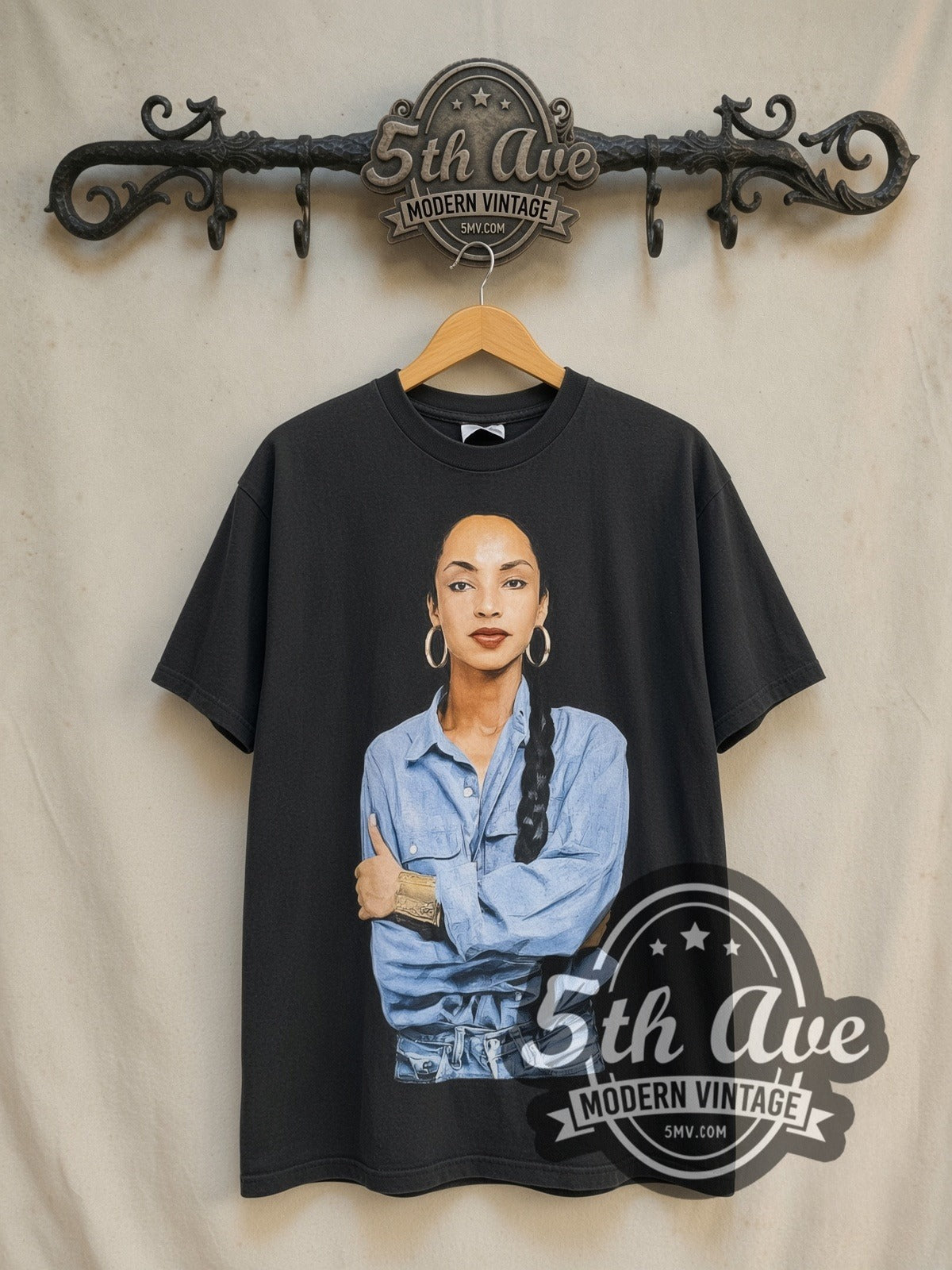 Sade Queen of Cool Crossed Arms Denim vintage band t-shirt in black, front view on a display rack
