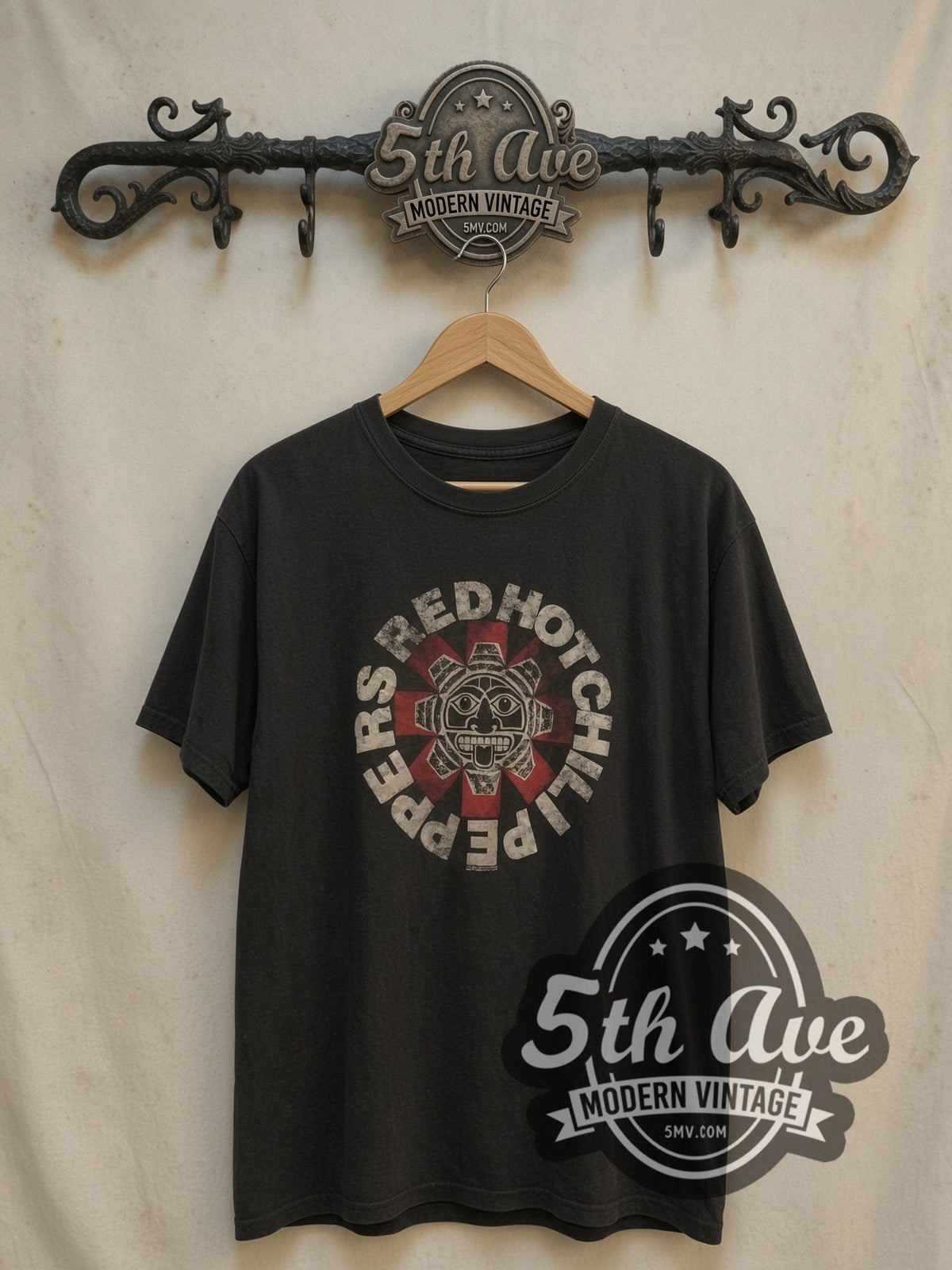 Red Hot Chili Peppers Aztec Sun Face Asterisk Black vintage band t-shirt in black, front view on a display rack