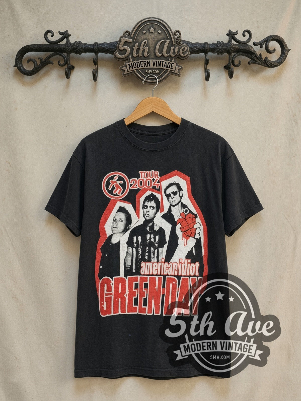 Green Day American Idiot Tour 2004 vintage band t-shirt in black, front view on a display rack