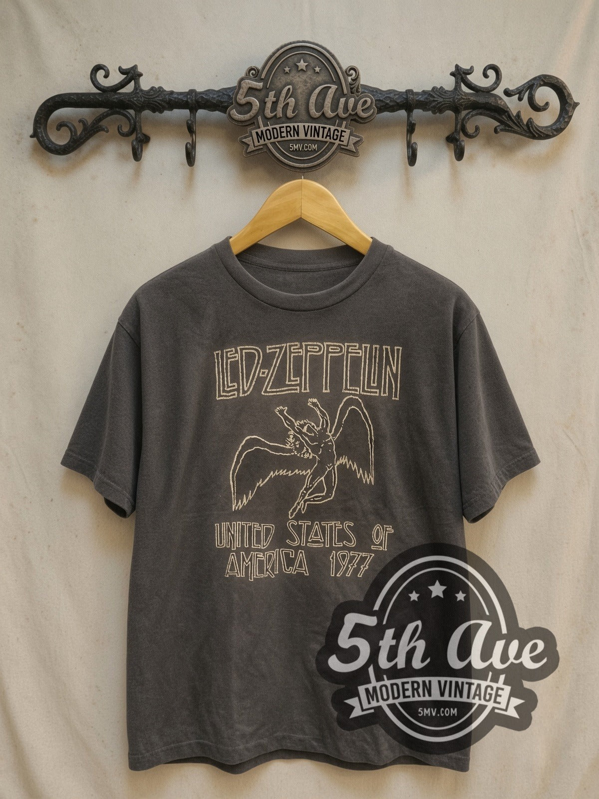 Led Zeppelin USA 1977 Icarus Logo vintage band t-shirt, front view on a display rack