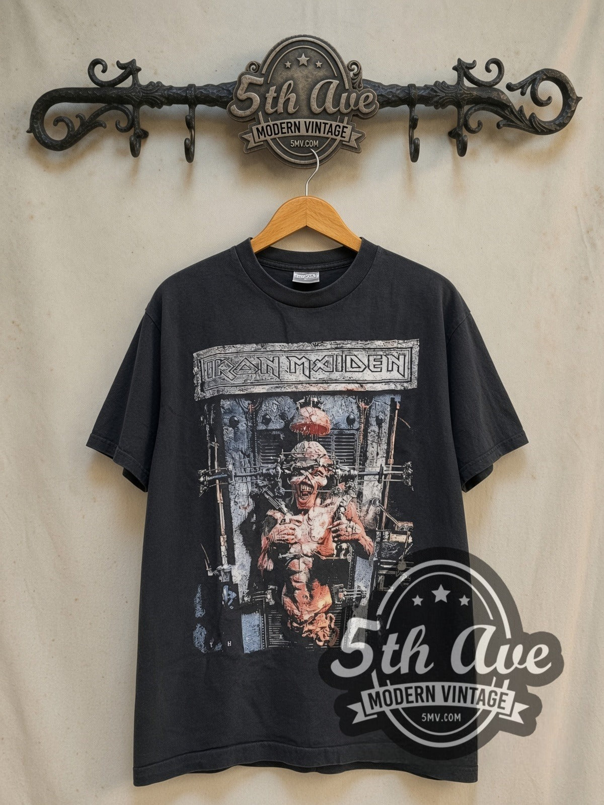 Iron Maiden The X Factor Tour' 1995 vintage band t-shirt in black, front view on a display rack