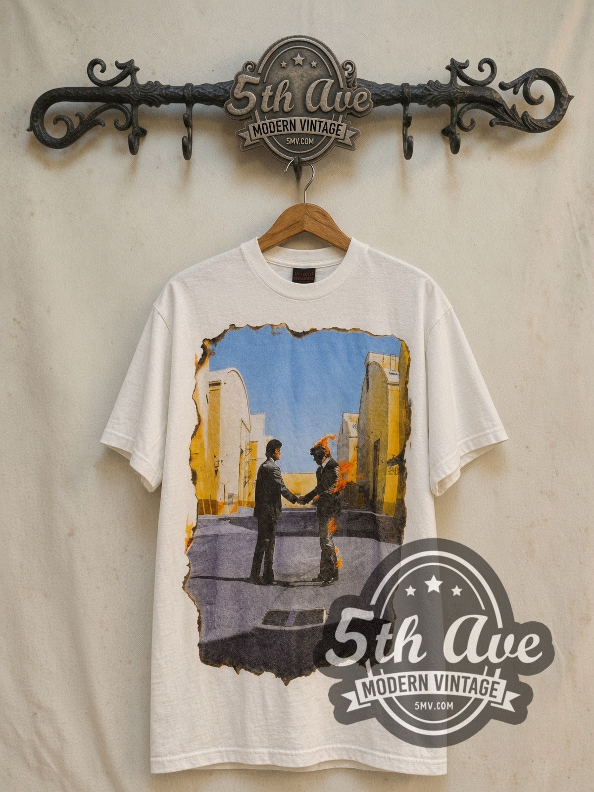 Pink Floyd Wish You Were Here vintage band t-shirt in white, front view on a display rack