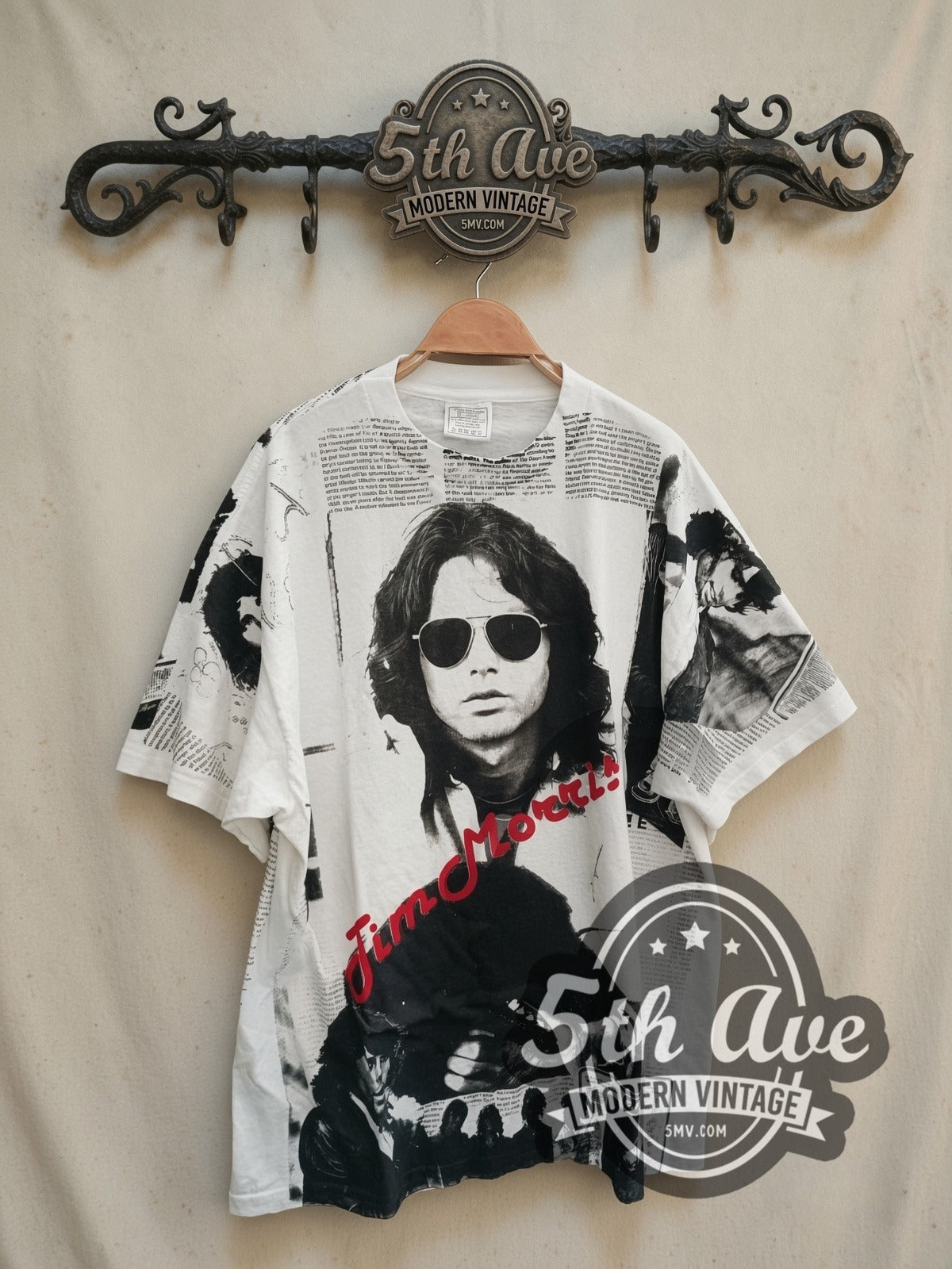 The Doors Jim Morrison Newspaper all-over-print vintage band t-shirt, front view on a display rack