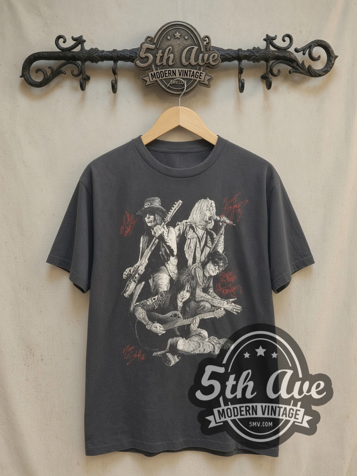 Mötley Crüe Autographed Members Group Photo vintage band t-shirt, front view on a display rack