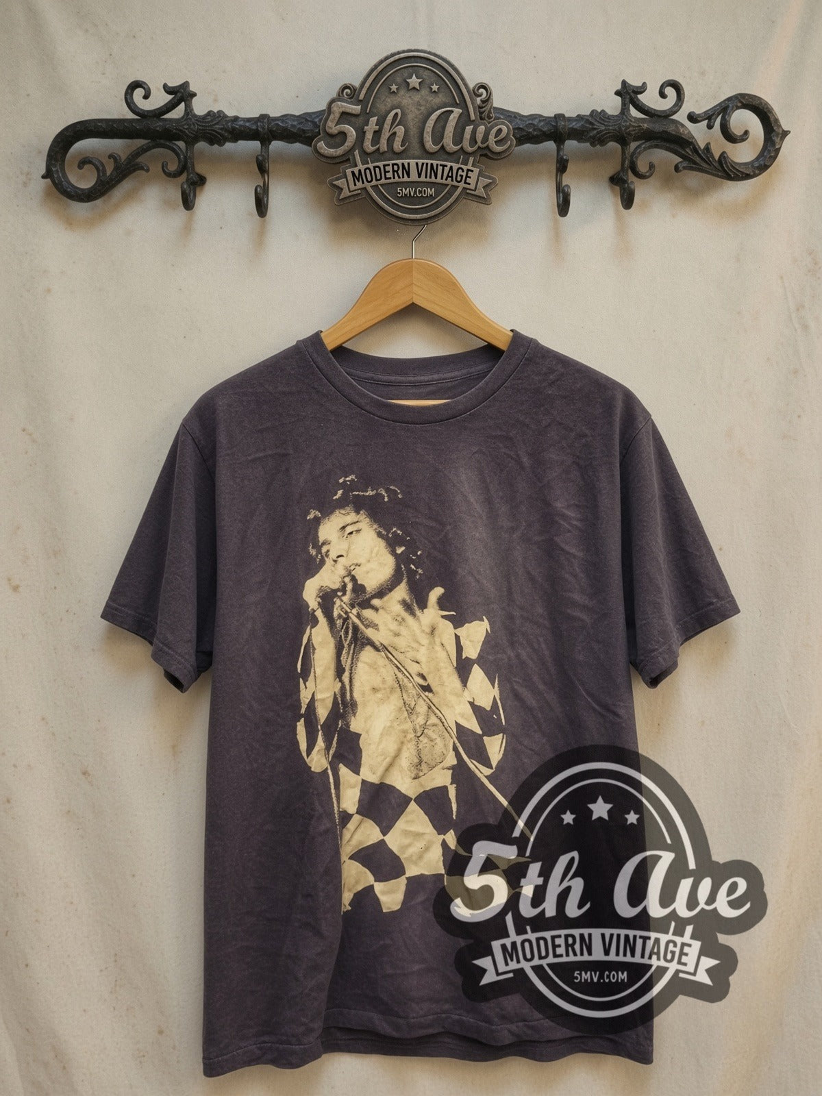 Freddie Mercury Harlequin Stage Portrait vintage band t-shirt, front view on a display rack