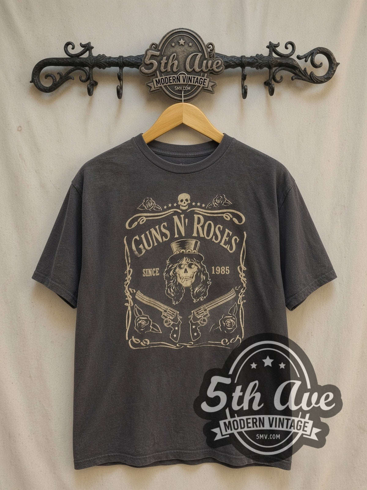 Guns N' Roses Est. 1985 Skull Label vintage band t-shirt, front view on a display rack