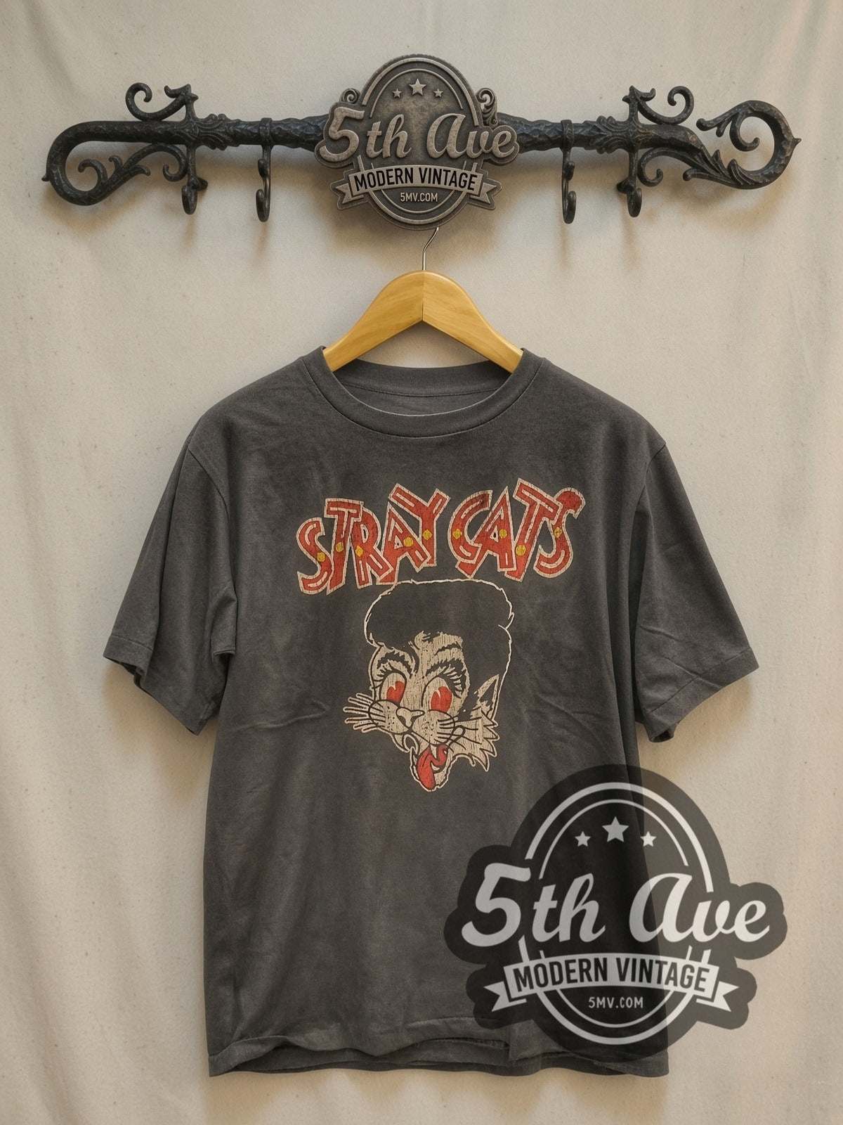 Stray Cats Red Eyes Pompadour Cat Logo vintage band t-shirt, front view on a display rack