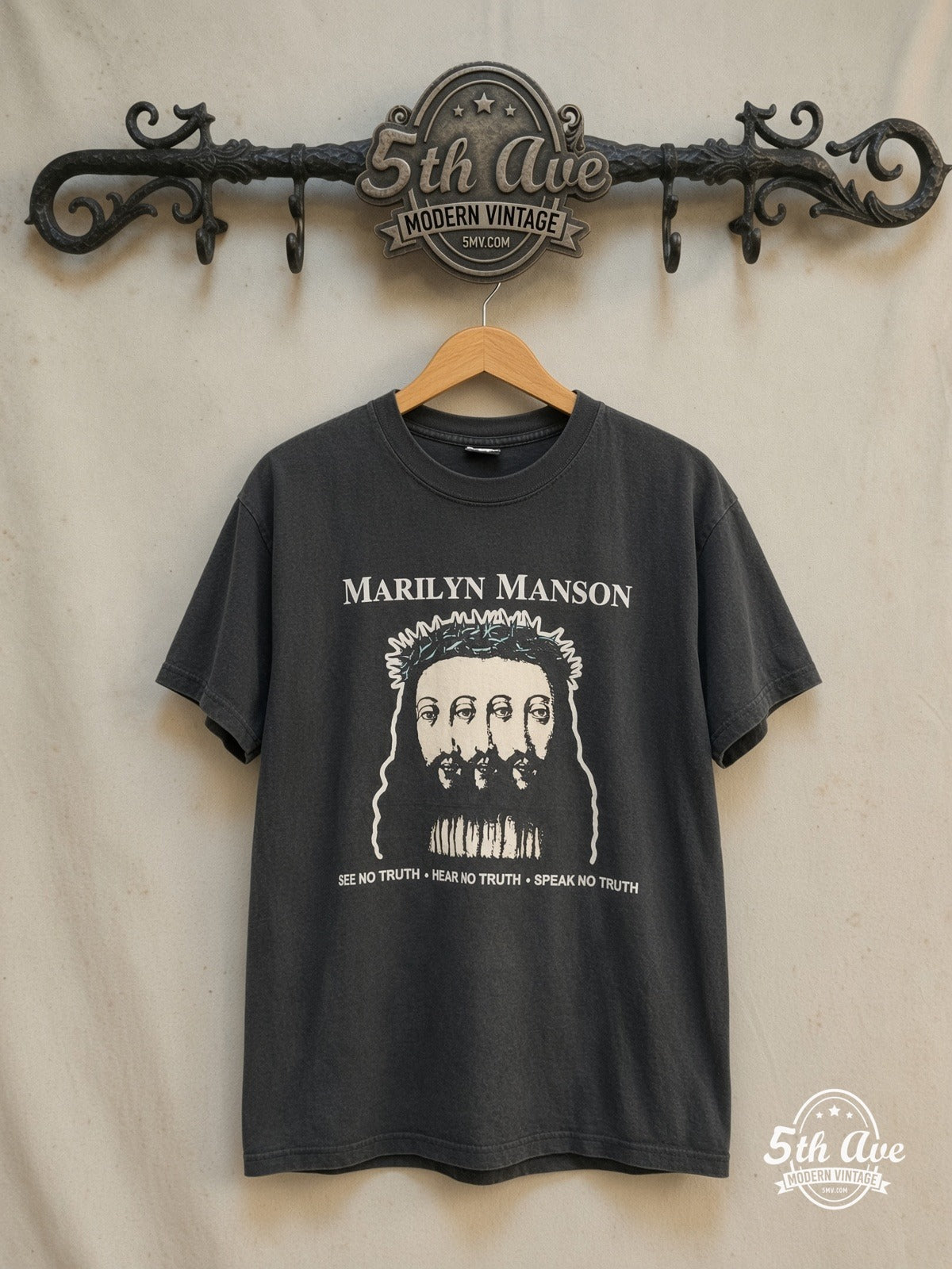 Marilyn Manson – Believe – Vintage Band T-Shirt — front on locked cream ornate 5th Ave rack