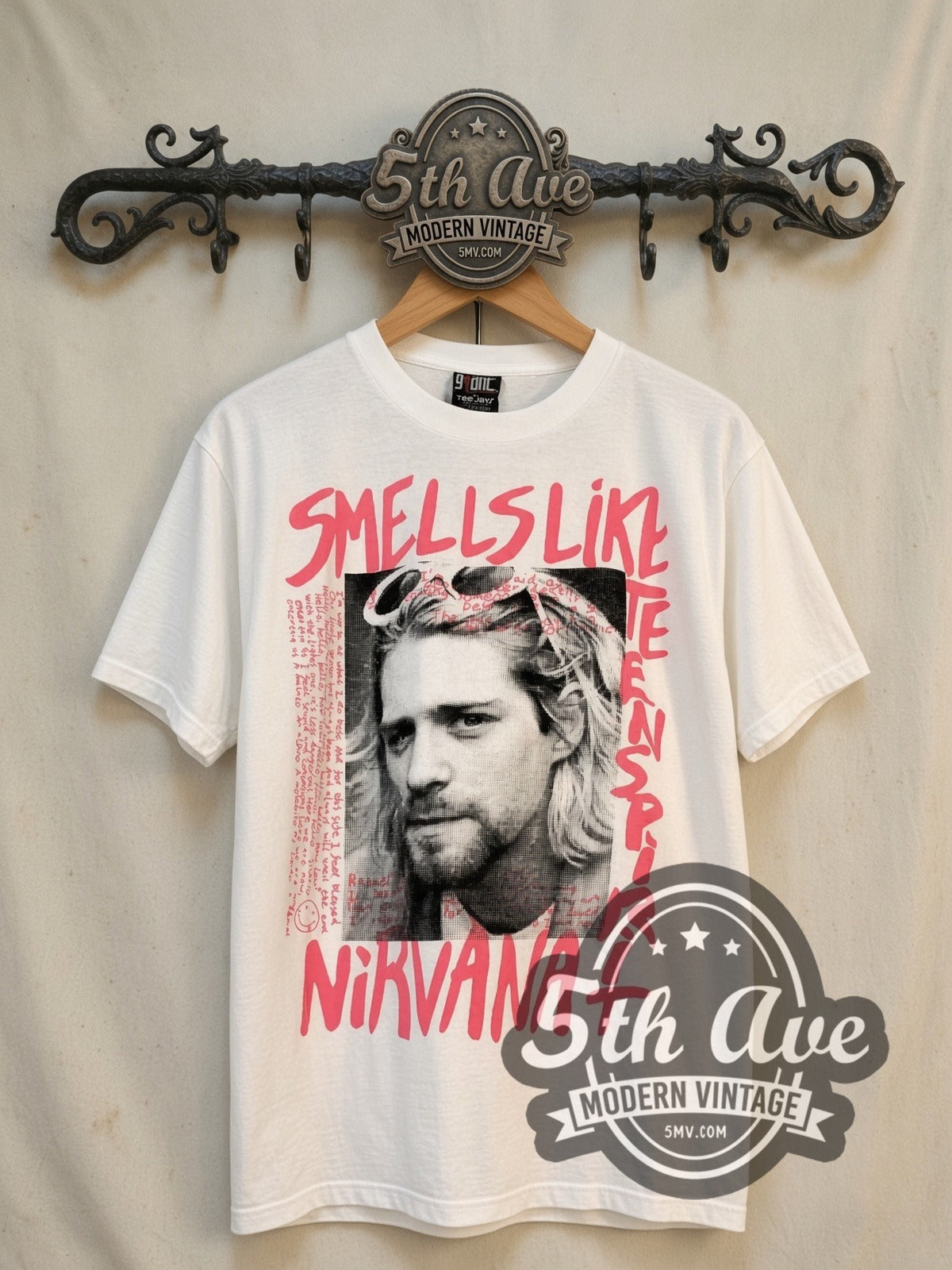 Nirvana Kurt Cobain Nirvana vintage band t-shirt, front view on a display rack
