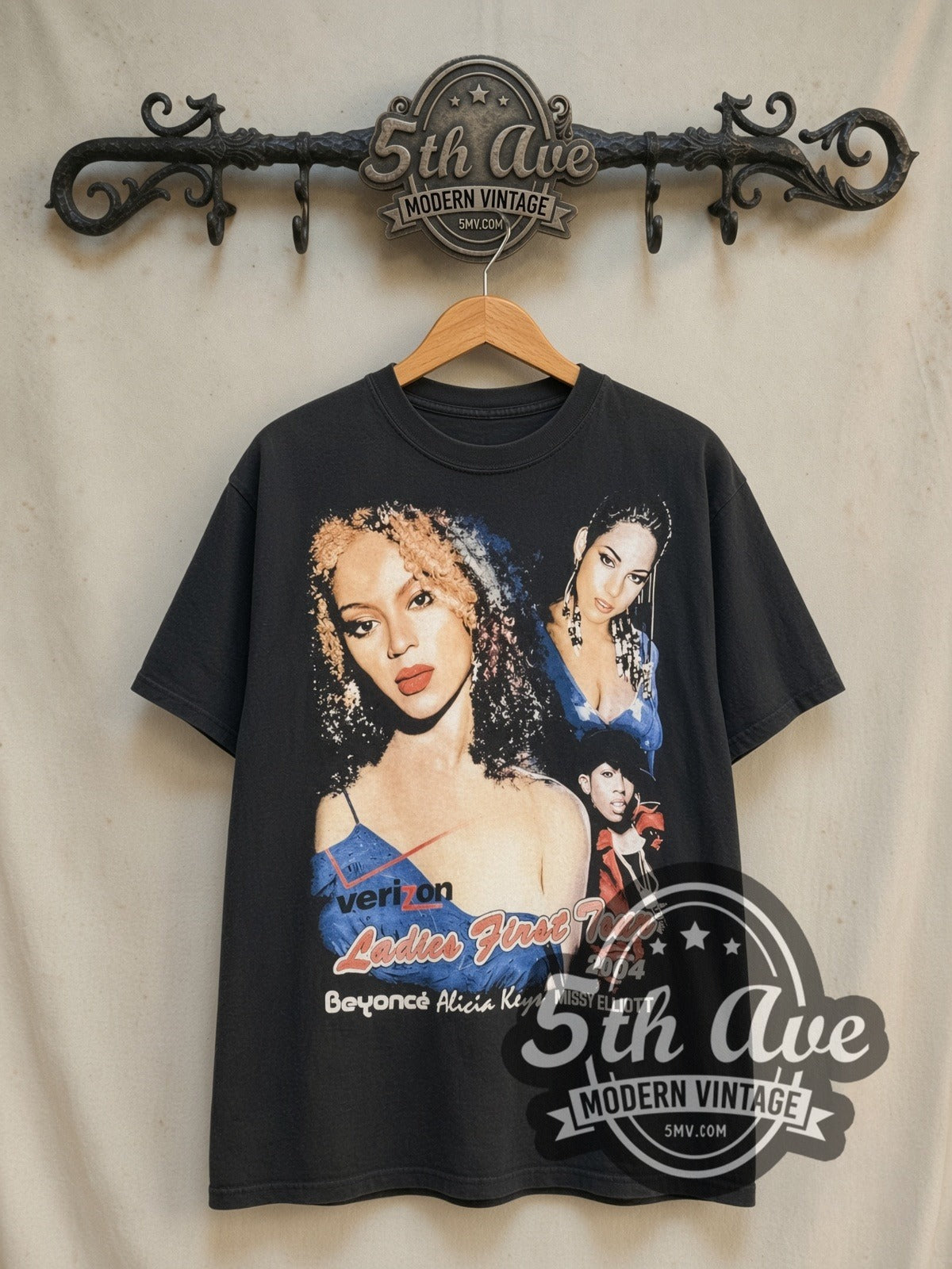 Beyoncé, Alicia Keys and Missy Elliott Verizon Ladies First Tour vintage band t-shirt in black, front view on a display rack