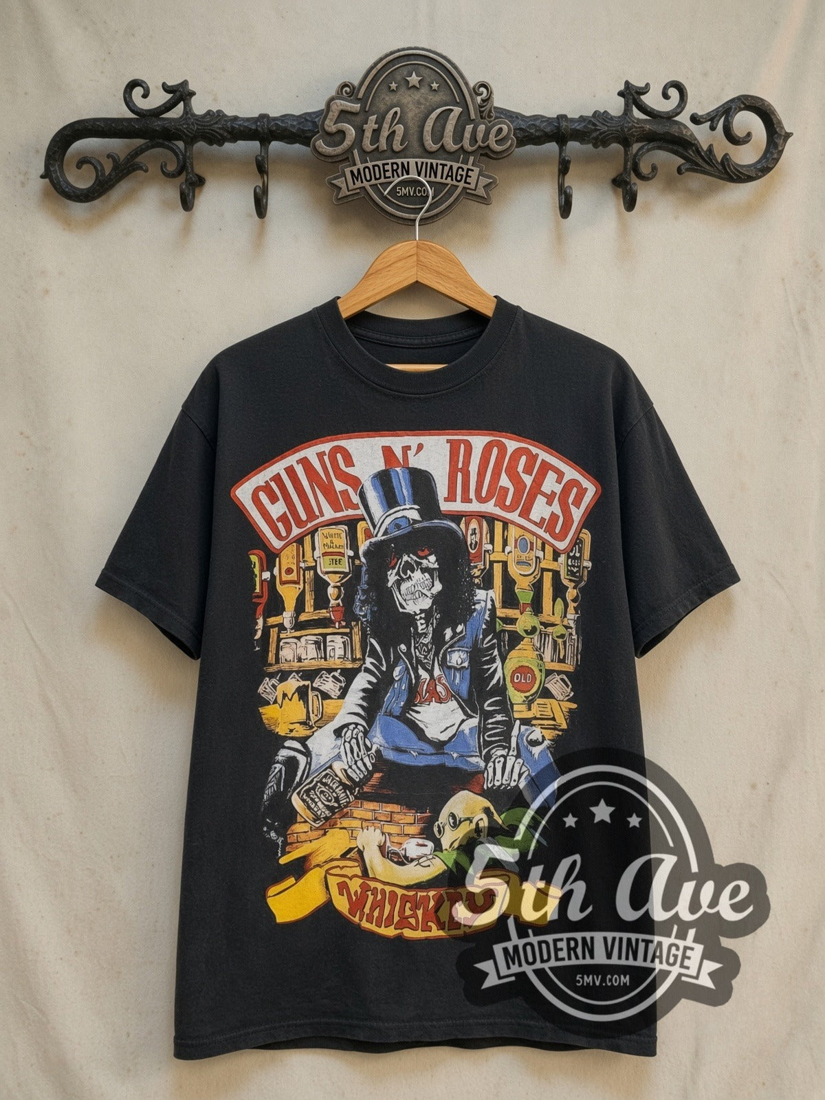 Guns N' Roses Whiskey all-over-print vintage band t-shirt in black, front view on a display rack
