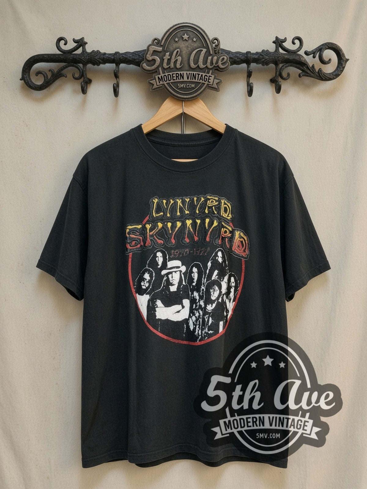 Lynyrd Skynyrd 1970–1977 Band Image vintage band t-shirt, front view on a display rack