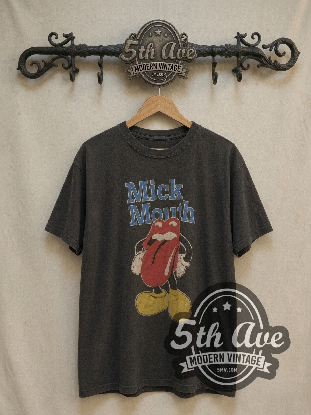 McMouth Iconic Lips Logo vintage band t-shirt, front view on a display rack