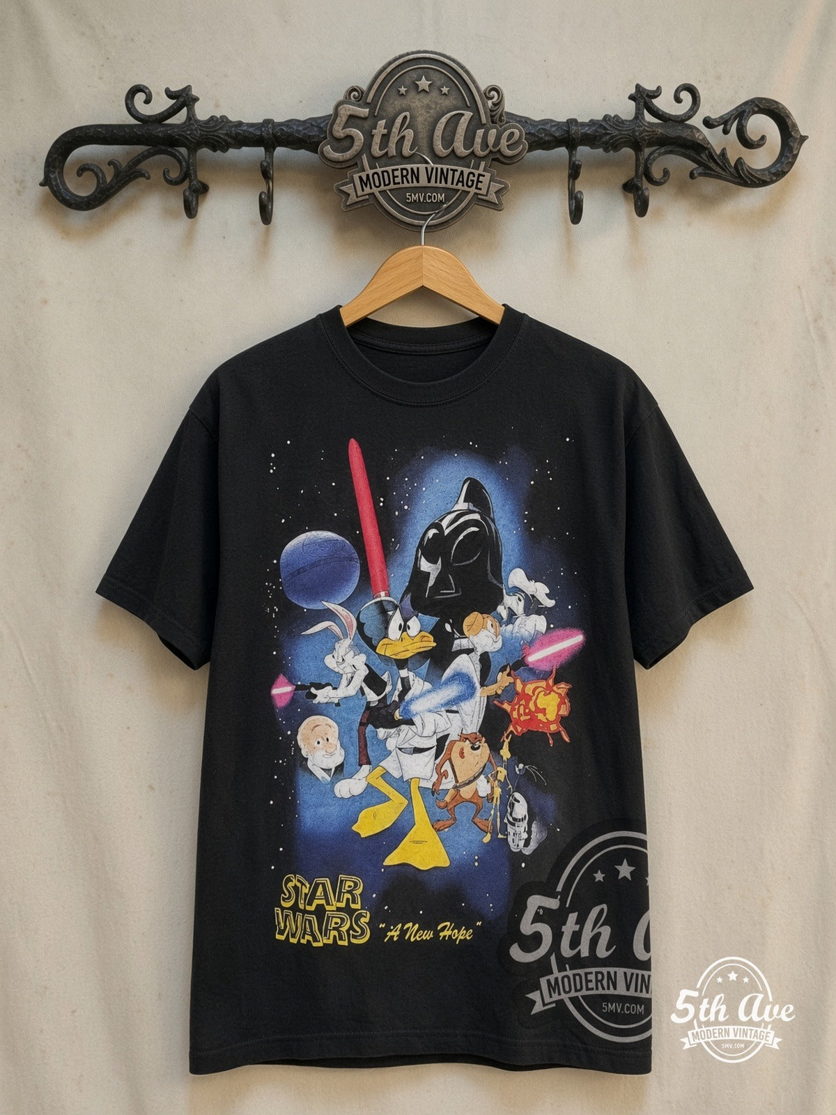 Bugs Bunny and Friends x Star Wars graphic tee in black, front view on a display rack